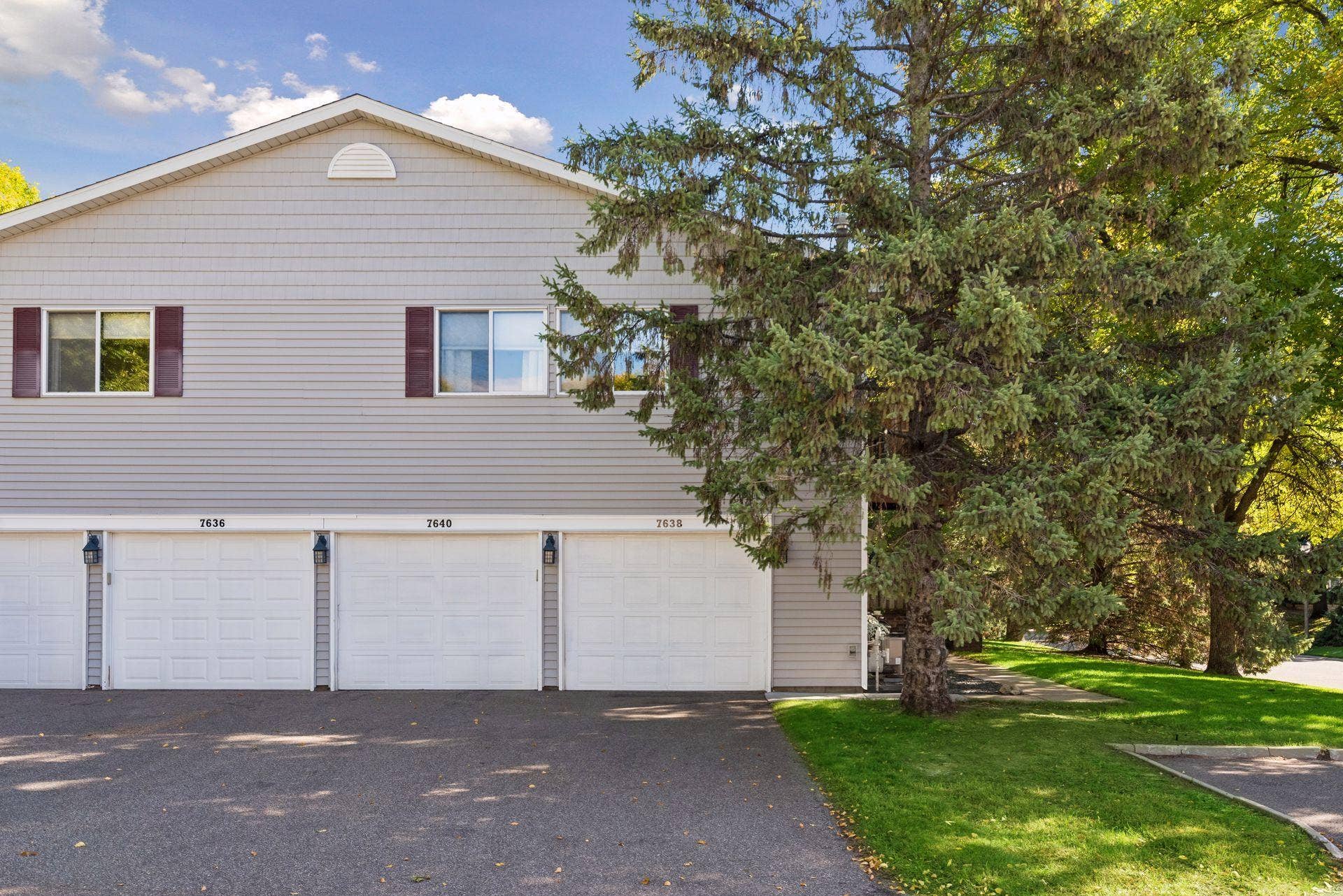 7638 13th Street N, Oakdale, MN 55128 The one-car tuckunder garage belonging to this home is on the far right, marked 7638. Freshly painted inside, with the garage-door opener replaced in 2019.