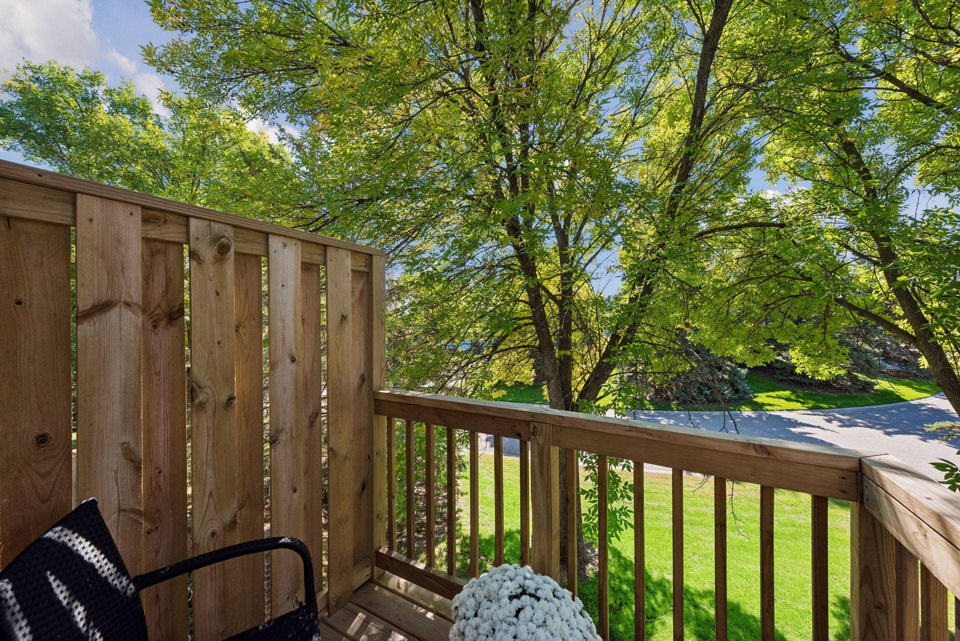 7638 13th Street N, Oakdale, MN 55128 Step outside for a breath of fresh air or a quiet reading breakthe brand-new deck offers a cozy retreat tucked among mature branches.