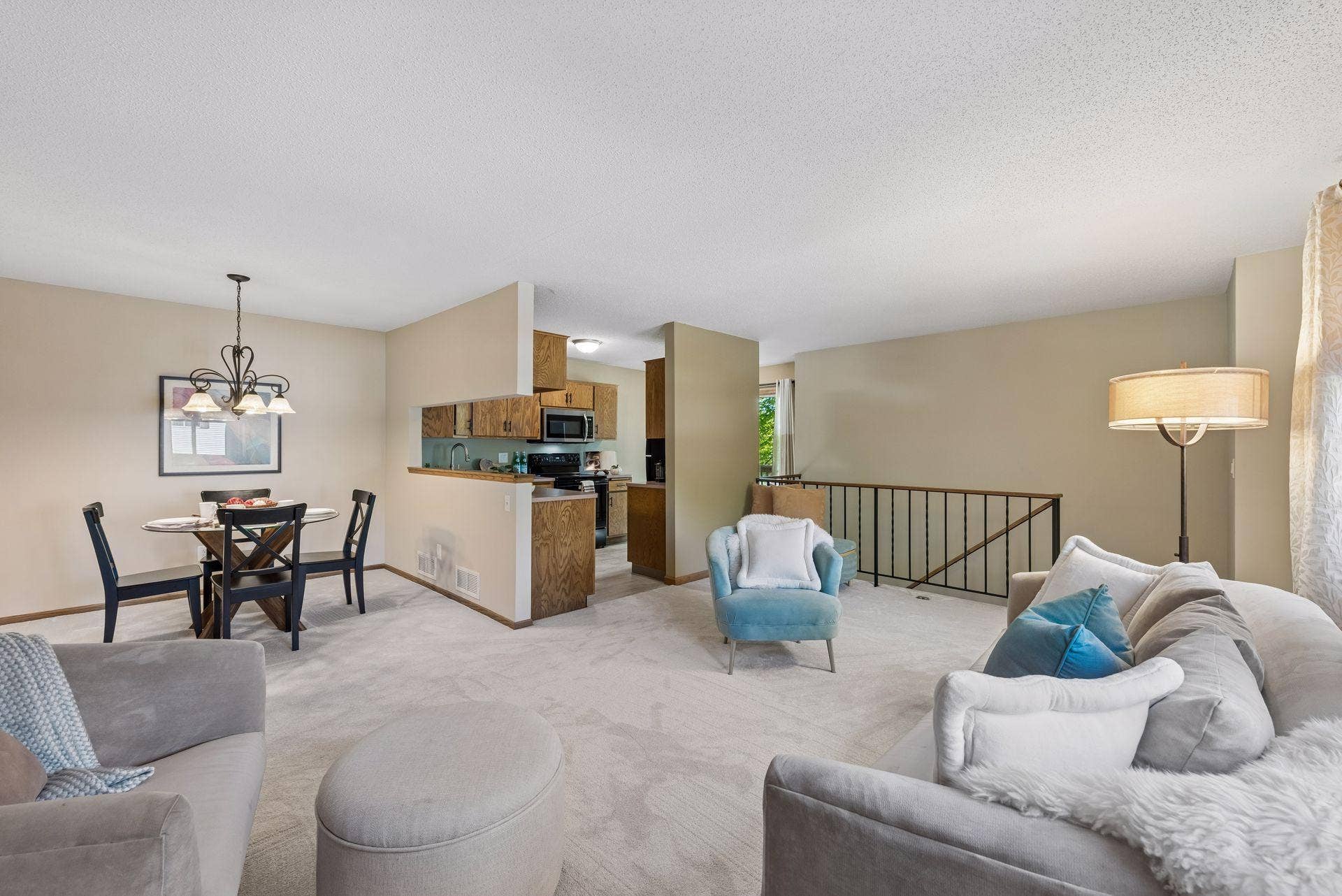 7638 13th Street N, Oakdale, MN 55128 From a relaxed evening on the sofa to dinner with friends, the connected living and dining spaces keep everyone close, with a convenient pass-through to the kitchen.