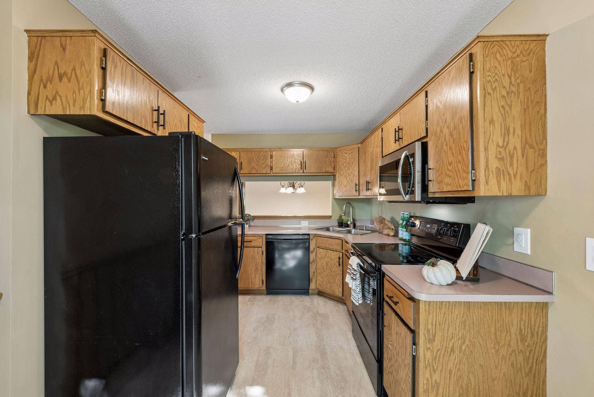 7638 13th Street N, Oakdale, MN 55128 Appliance updates are already in place: a brand-new microwave, plus a refrigerator, stove and dishwasher replaced around 2019. New flooring adds a fresh finishing touch.