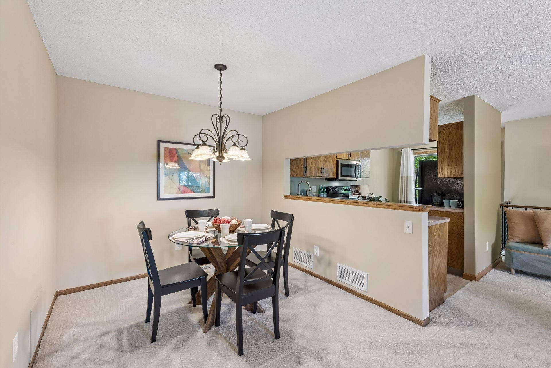 7638 13th Street N, Oakdale, MN 55128 A dedicated dining area makes room for everyday meals and special occasions, with the kitchen just steps away and a wide pass-through for easy serving.