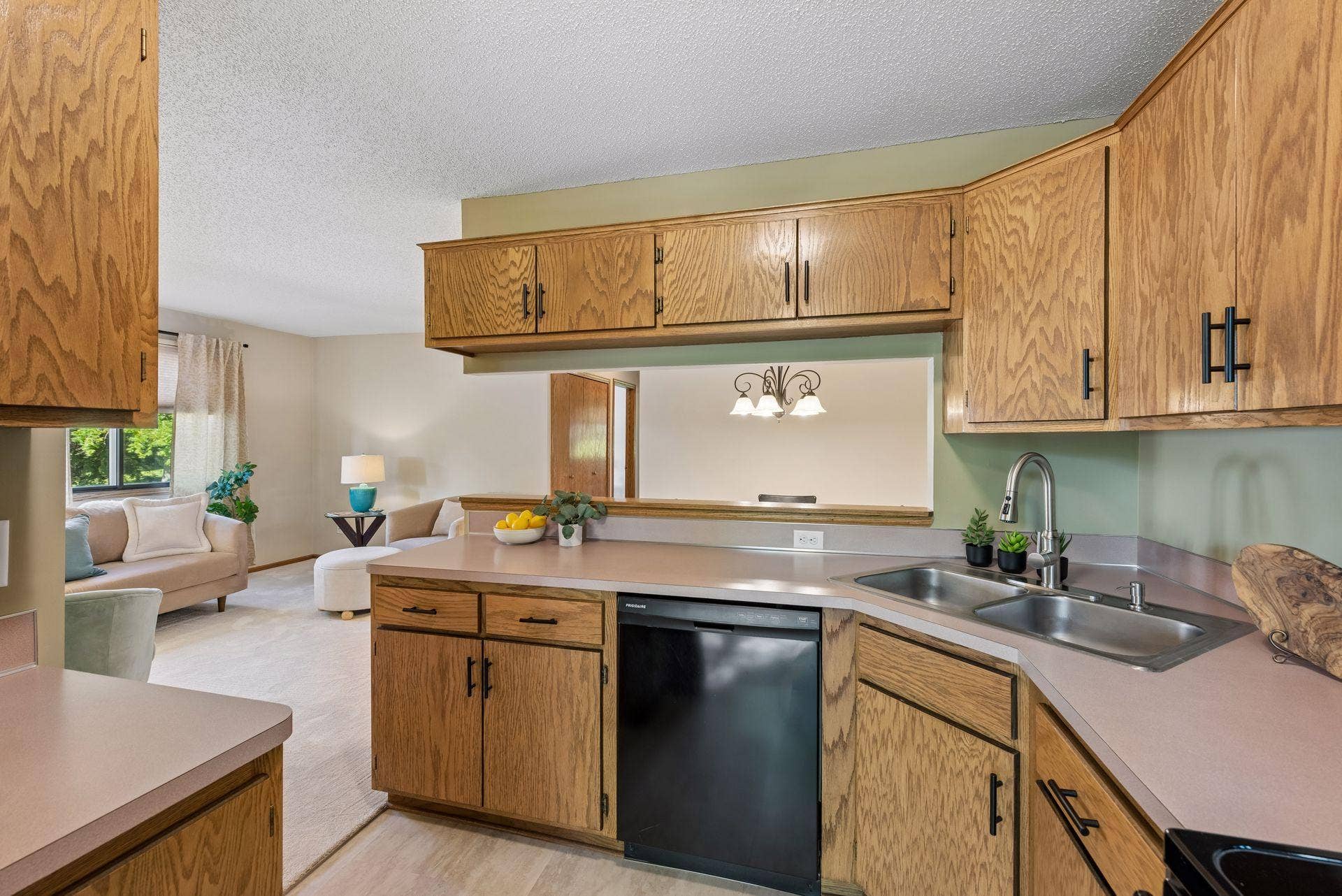 7638 13th Street N, Oakdale, MN 55128 Stay connected while cooking, with views into the living room and a wide pass-through to the dining areaplus plenty of cabinetry to keep things organized.