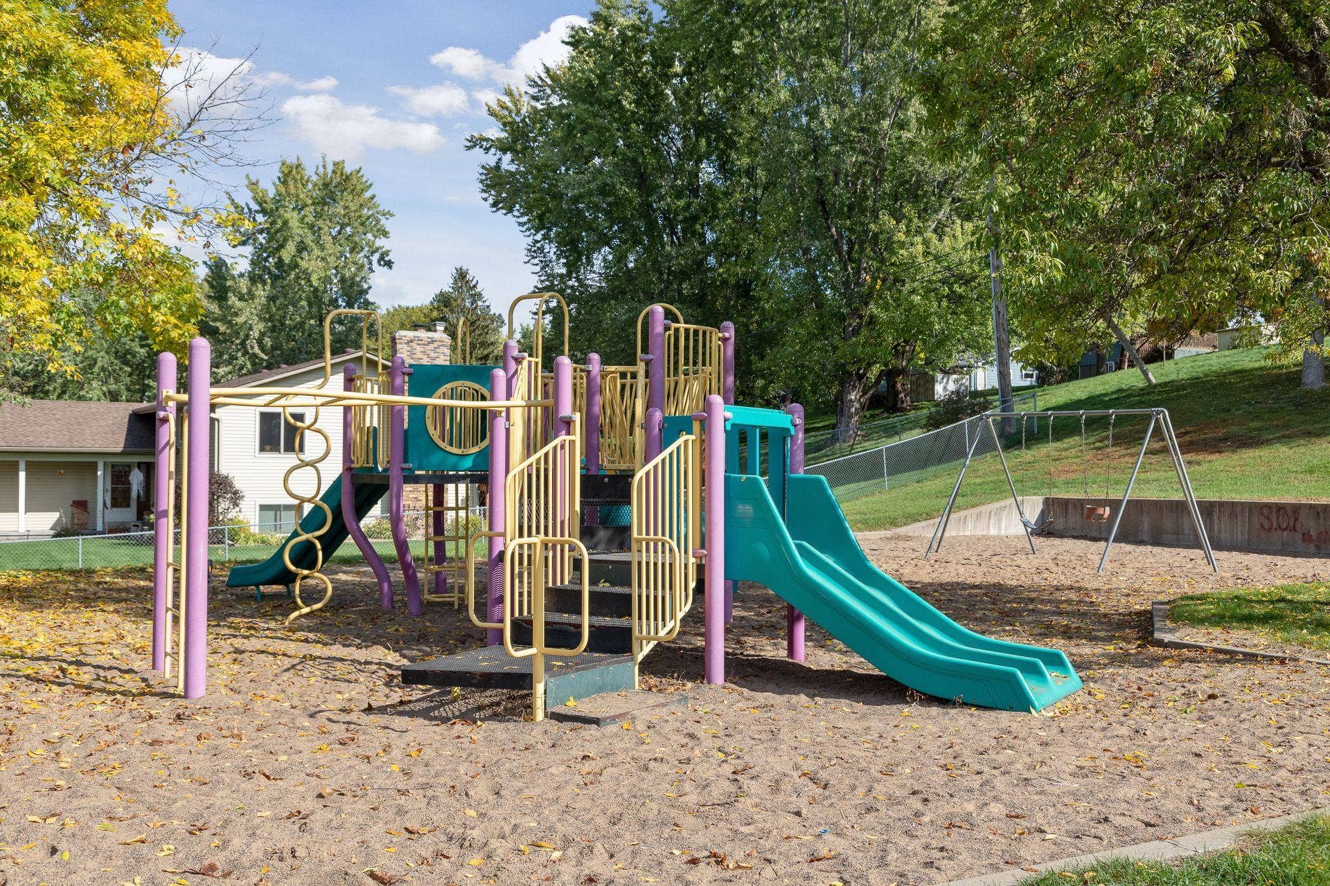 7638 13th Street N, Oakdale, MN 55128 Tower Park, less than a mile from home, offers a nearby spot for outdoor fun, with a playground, slides and swings surrounded by mature trees.