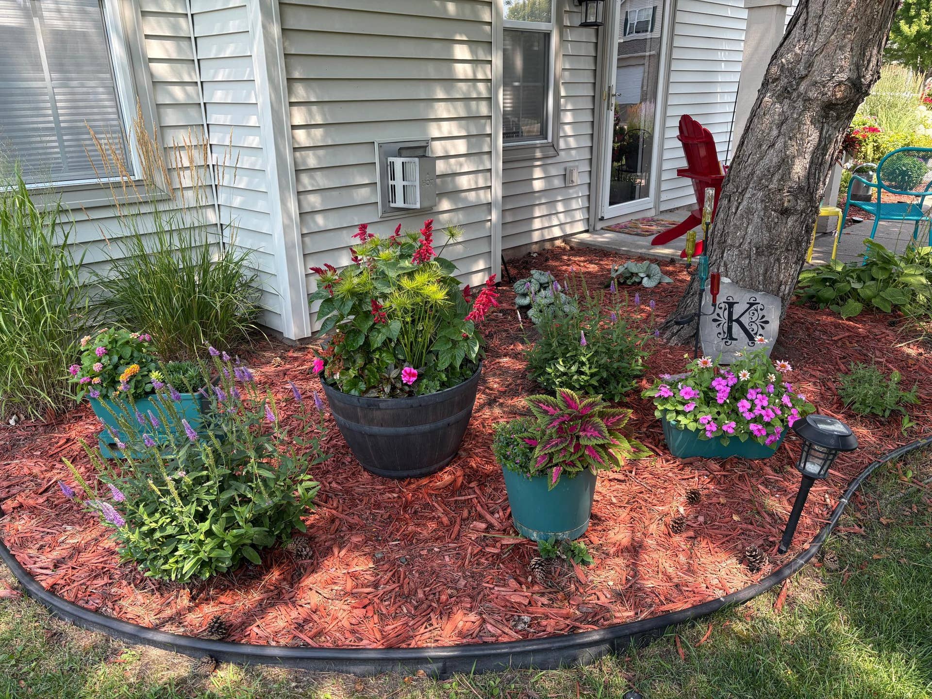 8967 Comstock Lane N, Maple Grove, MN 55311 Decorate your home with perennials and potted flowers. (Flowers at 8967 Comstock provided by seller)