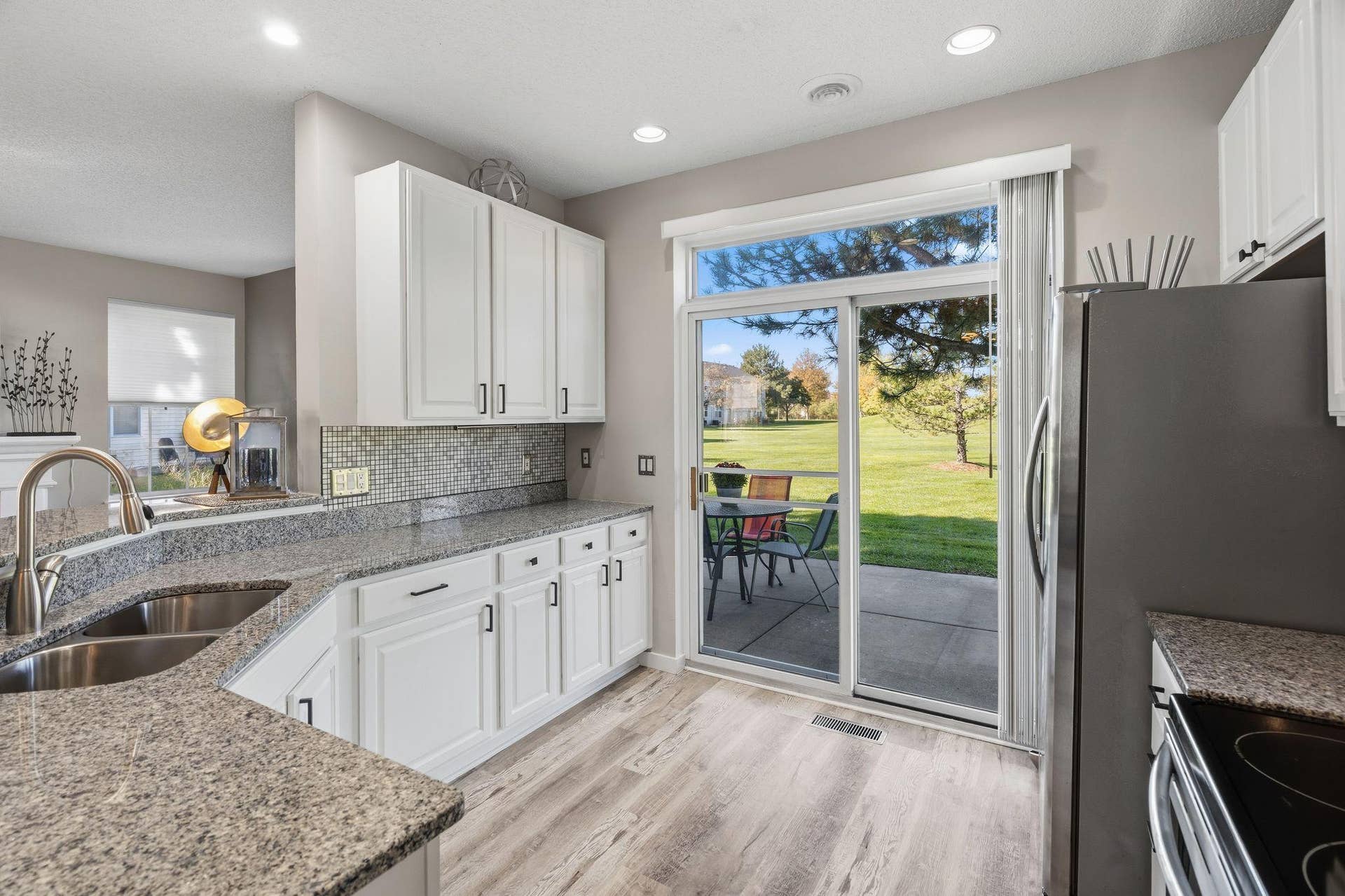 8967 Comstock Lane N, Maple Grove, MN 55311 Kitchen is light and bright. Close to the patio.