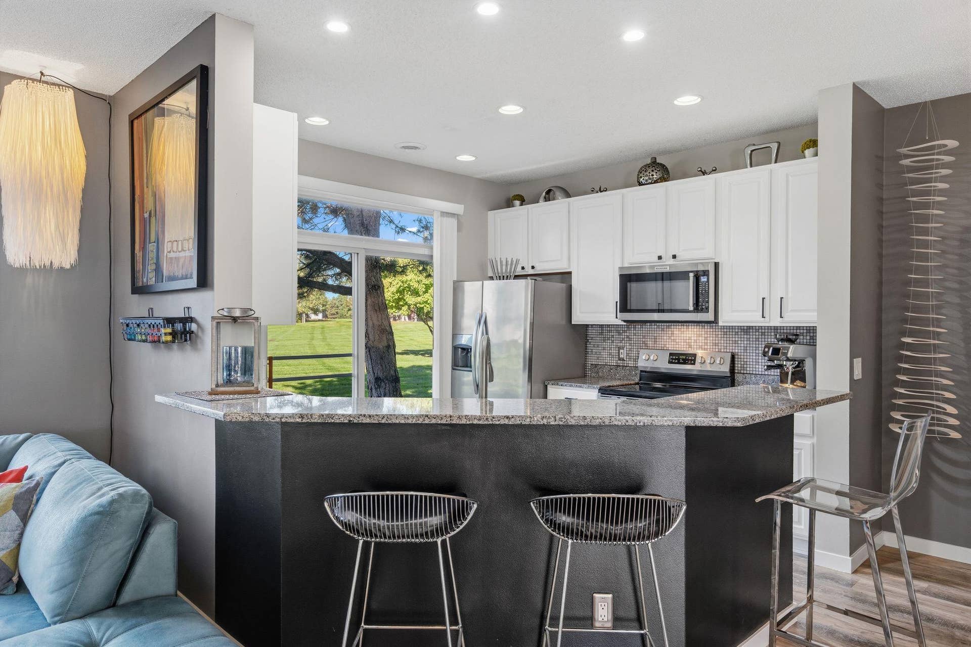 8967 Comstock Lane N, Maple Grove, MN 55311 Sitting at the breakfast bar also gives you a view of the green space outside.