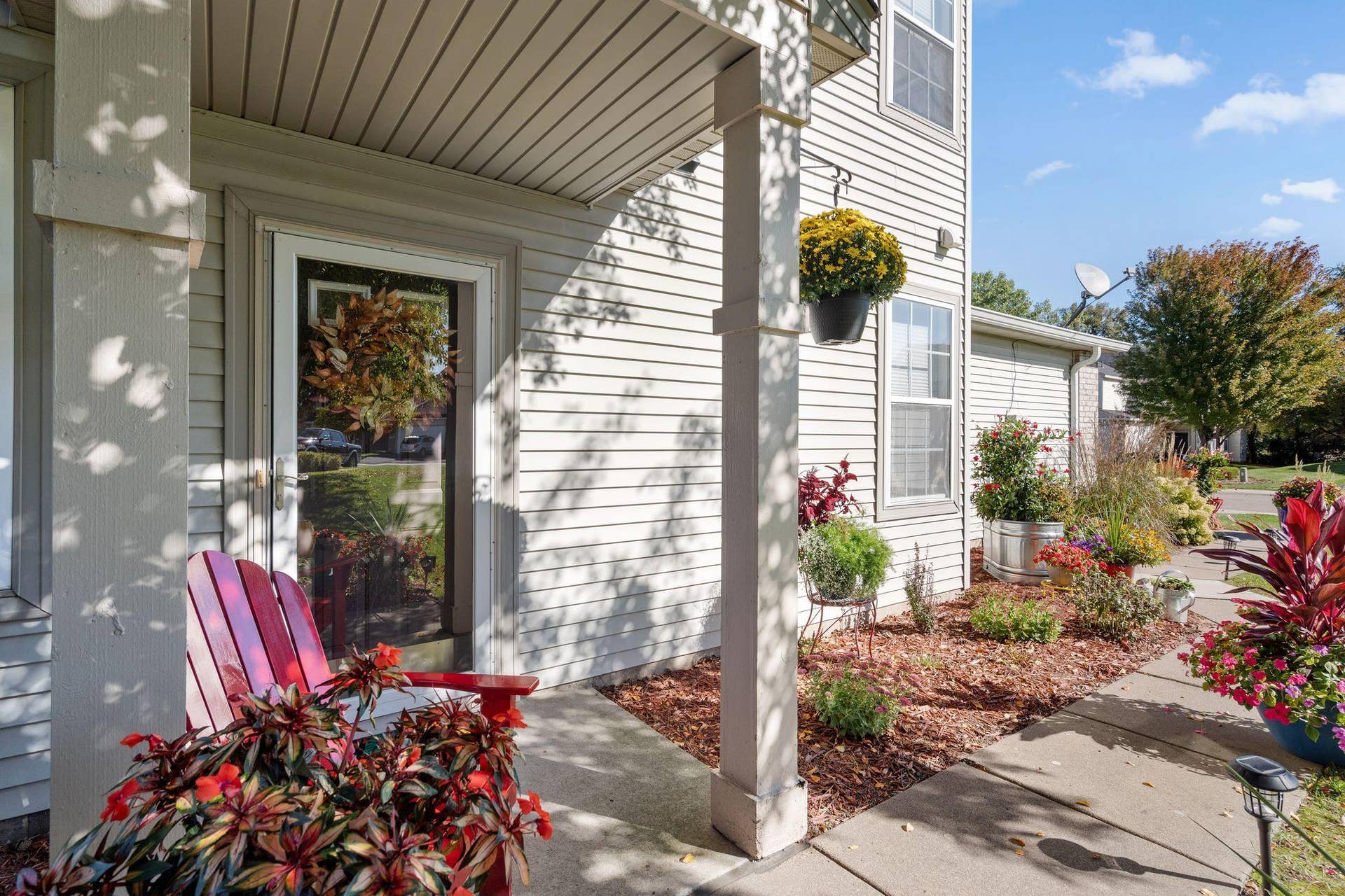 8967 Comstock Lane N, Maple Grove, MN 55311 Such a variety of flowers to enjoy as you walk to the house.