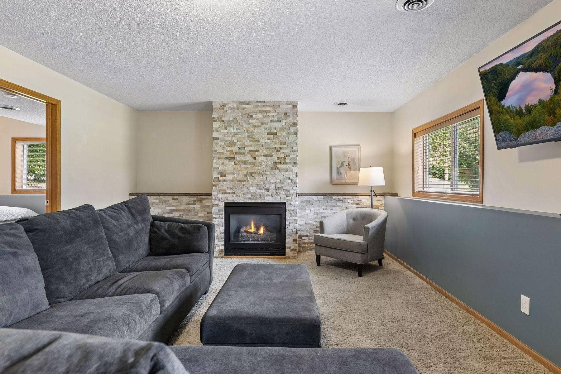 1049 Bonnieview Drive, Woodbury, MN 55129 Stay cozy by the gas fireplace with beautiful stone surround
