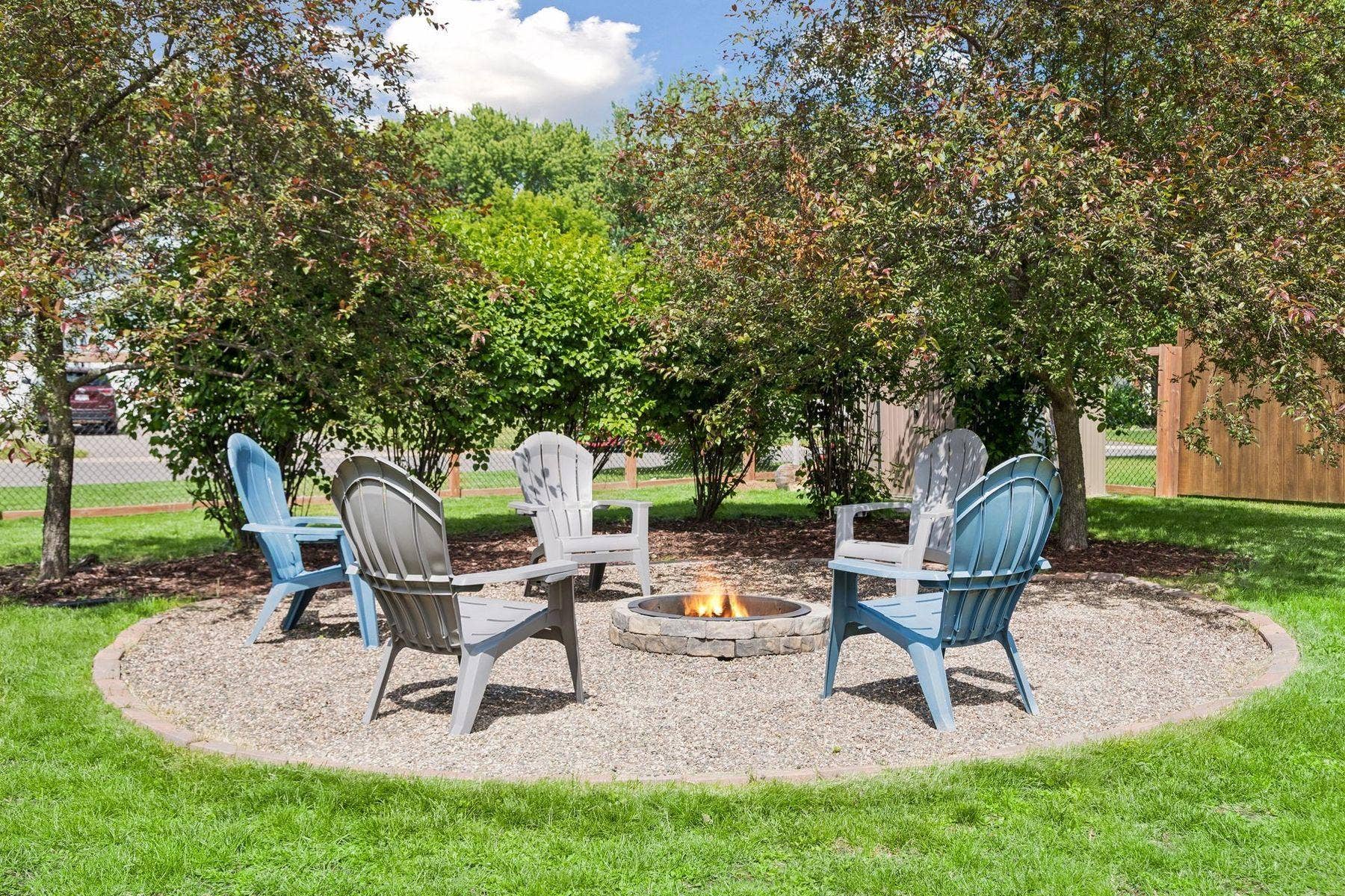 1049 Bonnieview Drive, Woodbury, MN 55129 Enjoy cool evenings around the bonfire