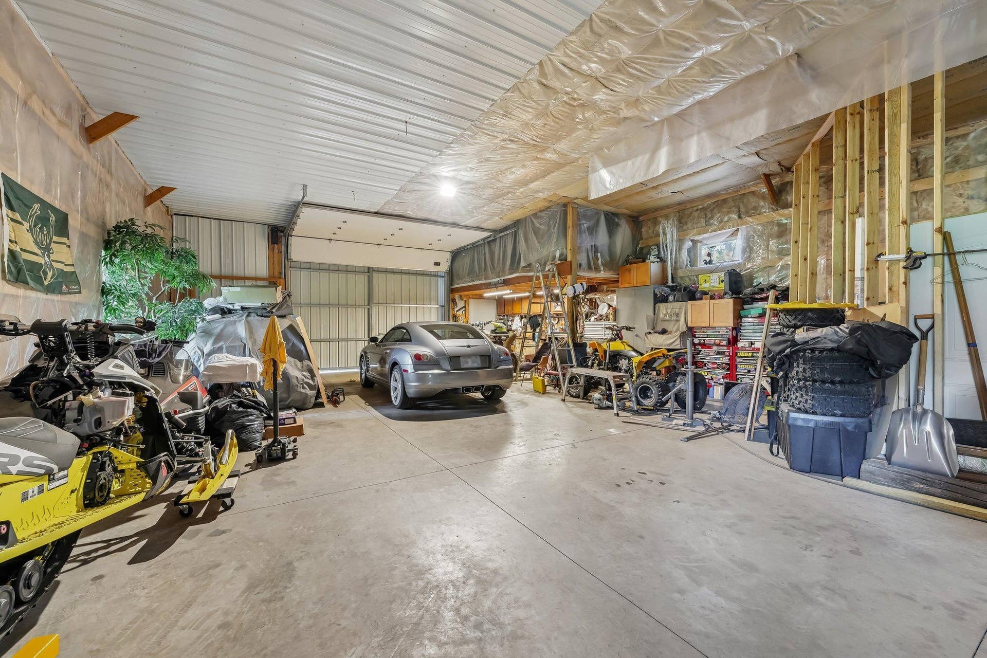 1252 Rolling Hills Trail, Hudson, WI 54016 View of inside insulated shed looking to the overhead door with sliders