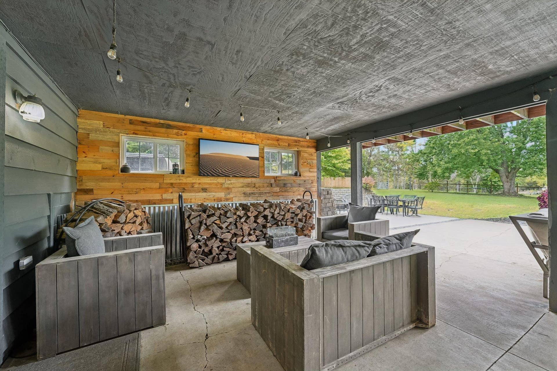 1252 Rolling Hills Trail, Hudson, WI 54016 Covered lower level patio to inground pool and view of backyard
