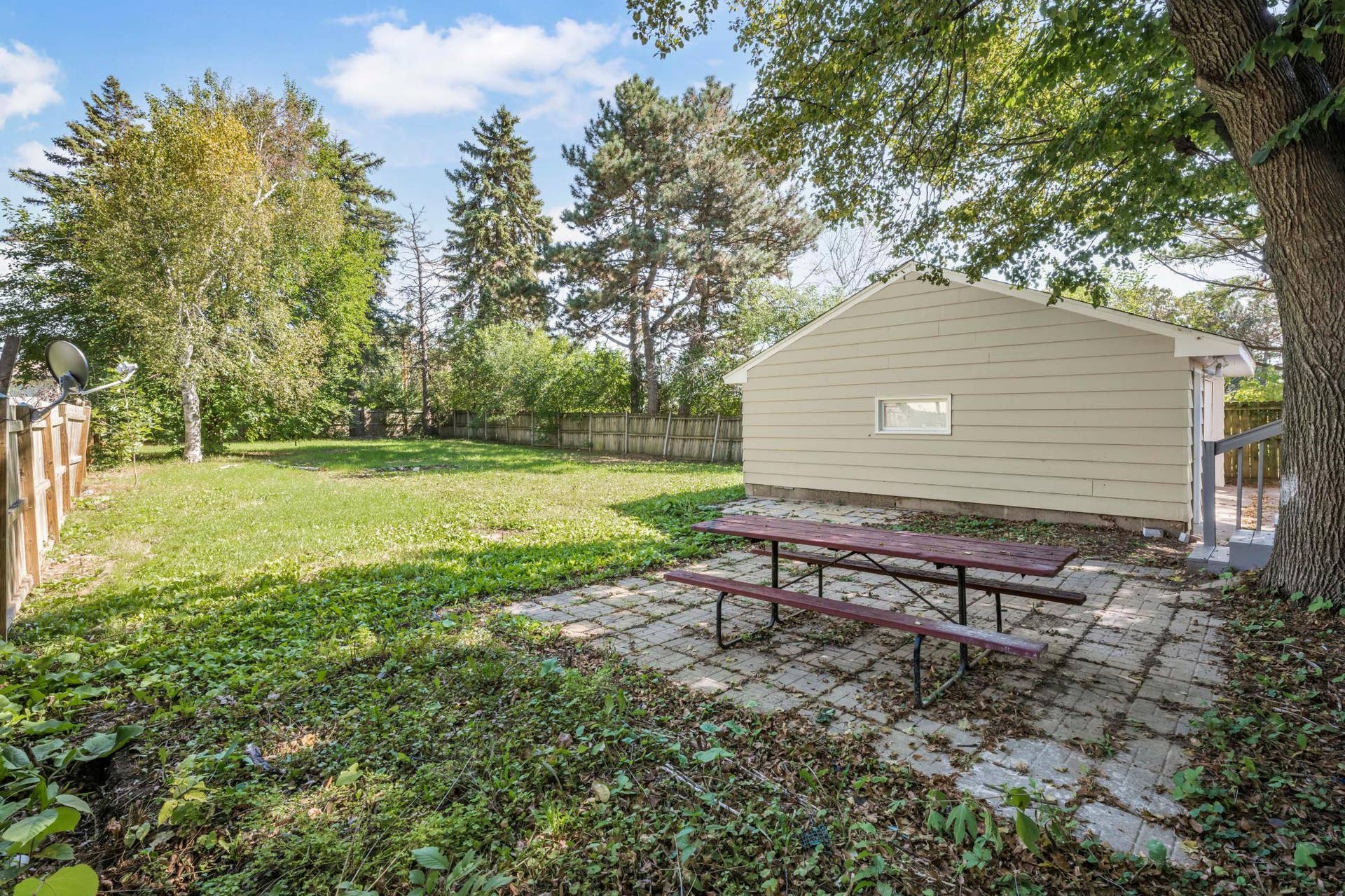 756 Mcknight Road N, Maplewood, MN 55119 Privacy fence surrounds the enormous backyard - ideal for 4 legged family members, gardens and yard games with friends and family