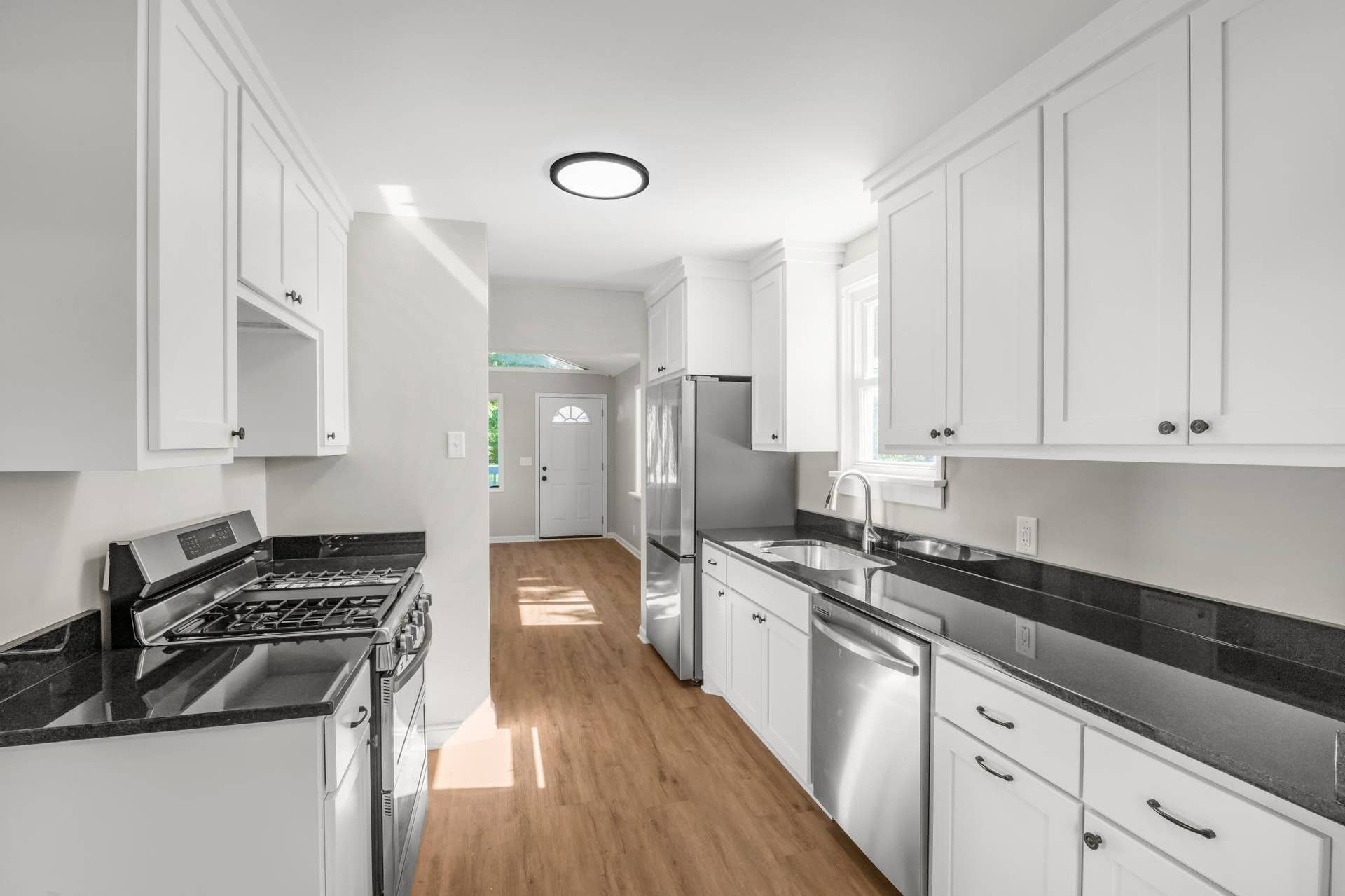 756 Mcknight Road N, Maplewood, MN 55119 Fully remodeled kitchen complete with new stainless steel appliances and granite countertop with a tuck-under sink