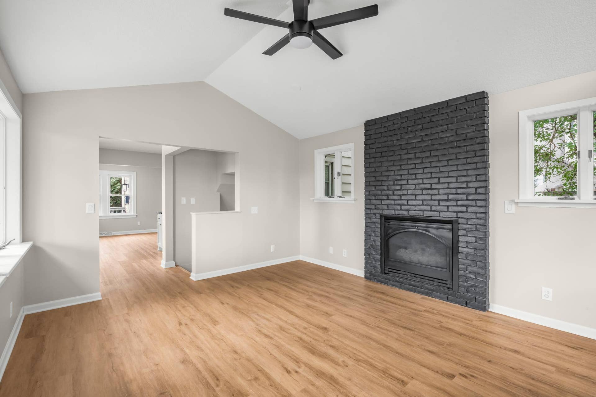 756 Mcknight Road N, Maplewood, MN 55119 The family room boasts vaulted ceilings and a gas fireplace as well as new flooring throughout the main floor