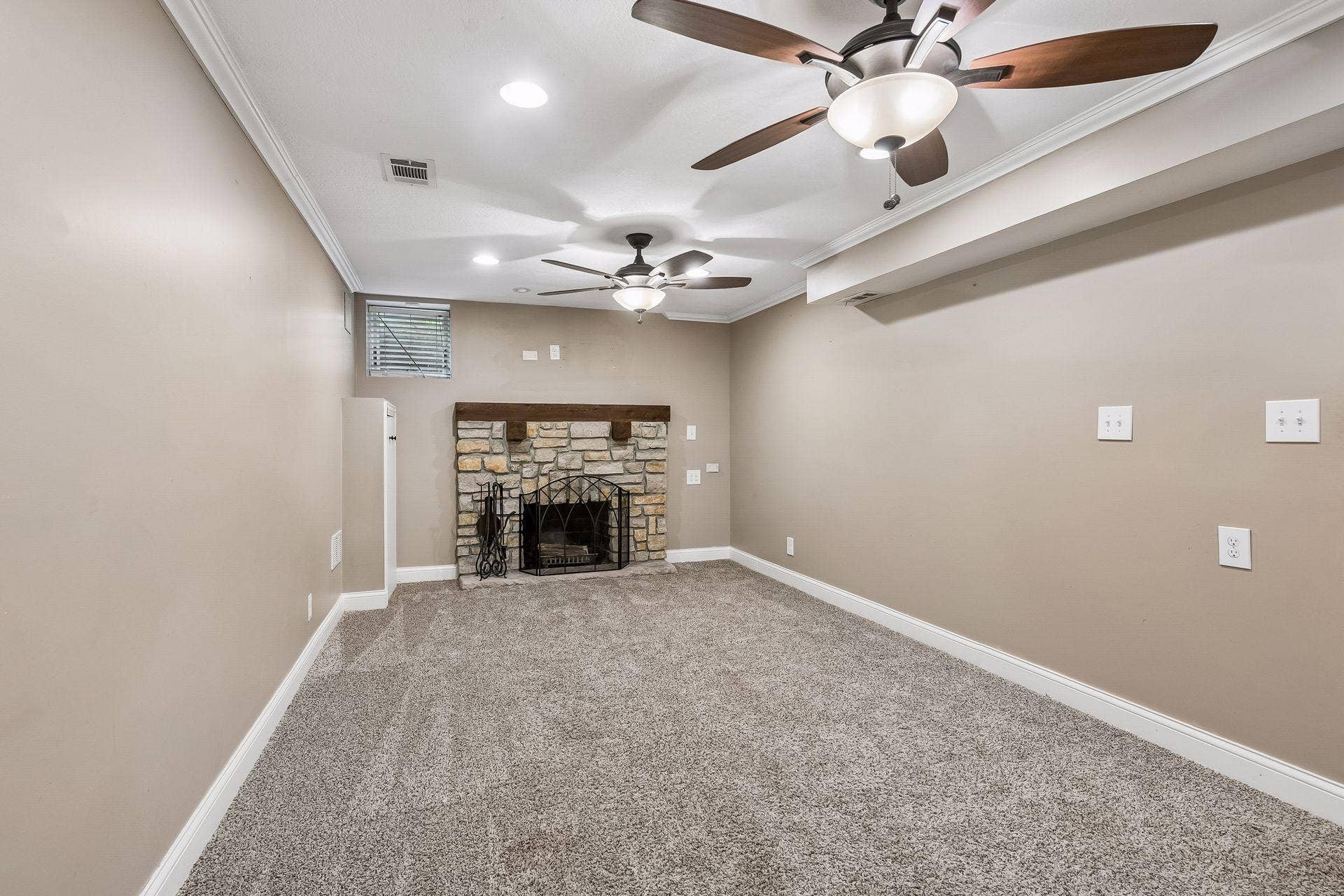Lower level family room with wood burning fire place