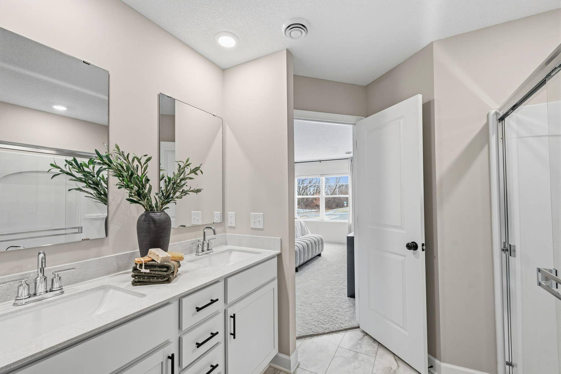 4004 Hayward Avenue N, Oakdale, MN 55128 Quartz countertops, Moen Glyde faucets and dual sinks come together at this impressive vanity