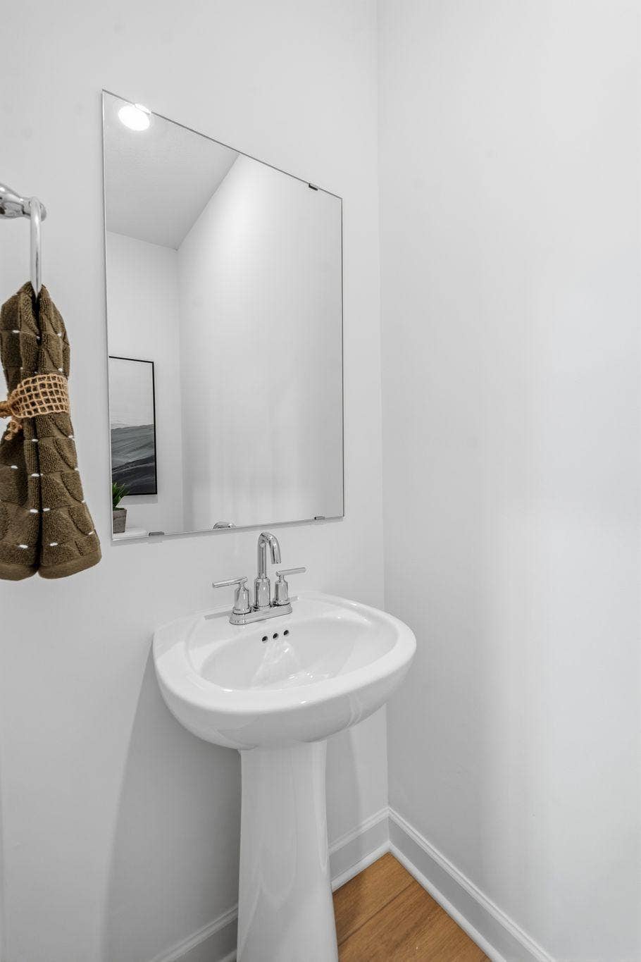 4004 Hayward Avenue N, Oakdale, MN 55128 In a discreet location on the first floor is a convenient powder room to accommodate the needs of the whole household and visiting guests.