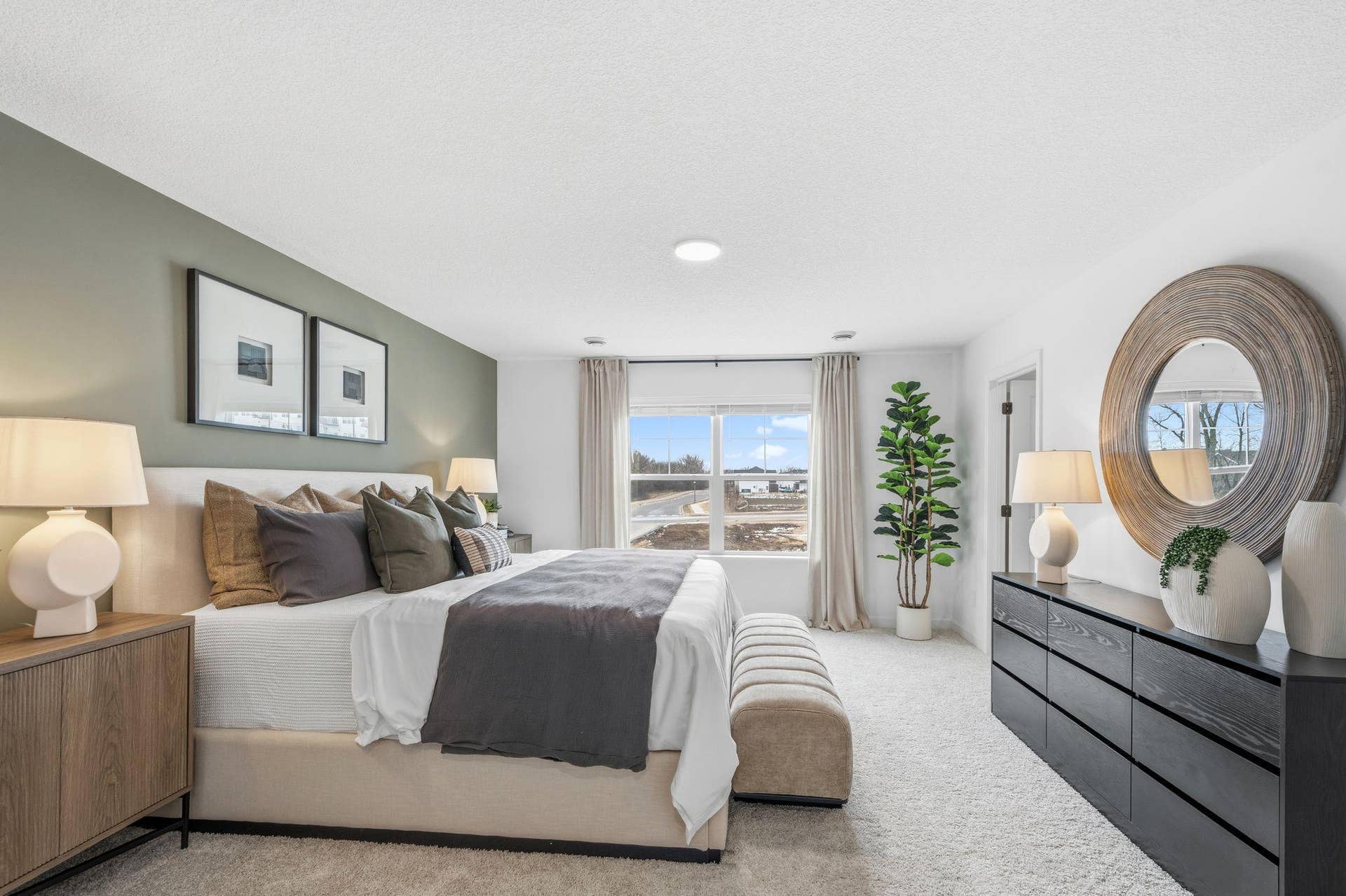 4004 Hayward Avenue N, Oakdale, MN 55128 The primary bedroom embraces natural light streaming in from the large windows