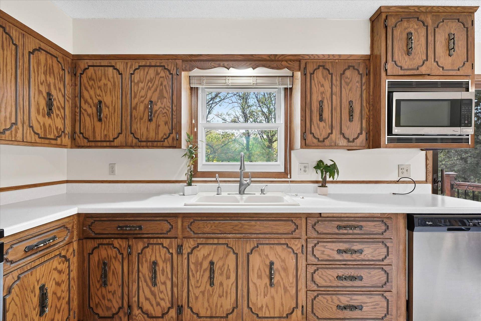 20761 187th Avenue NW, Big Lake, MN 55309 A large window bringing in natural light and providing beautiful views of the surrounding trees.