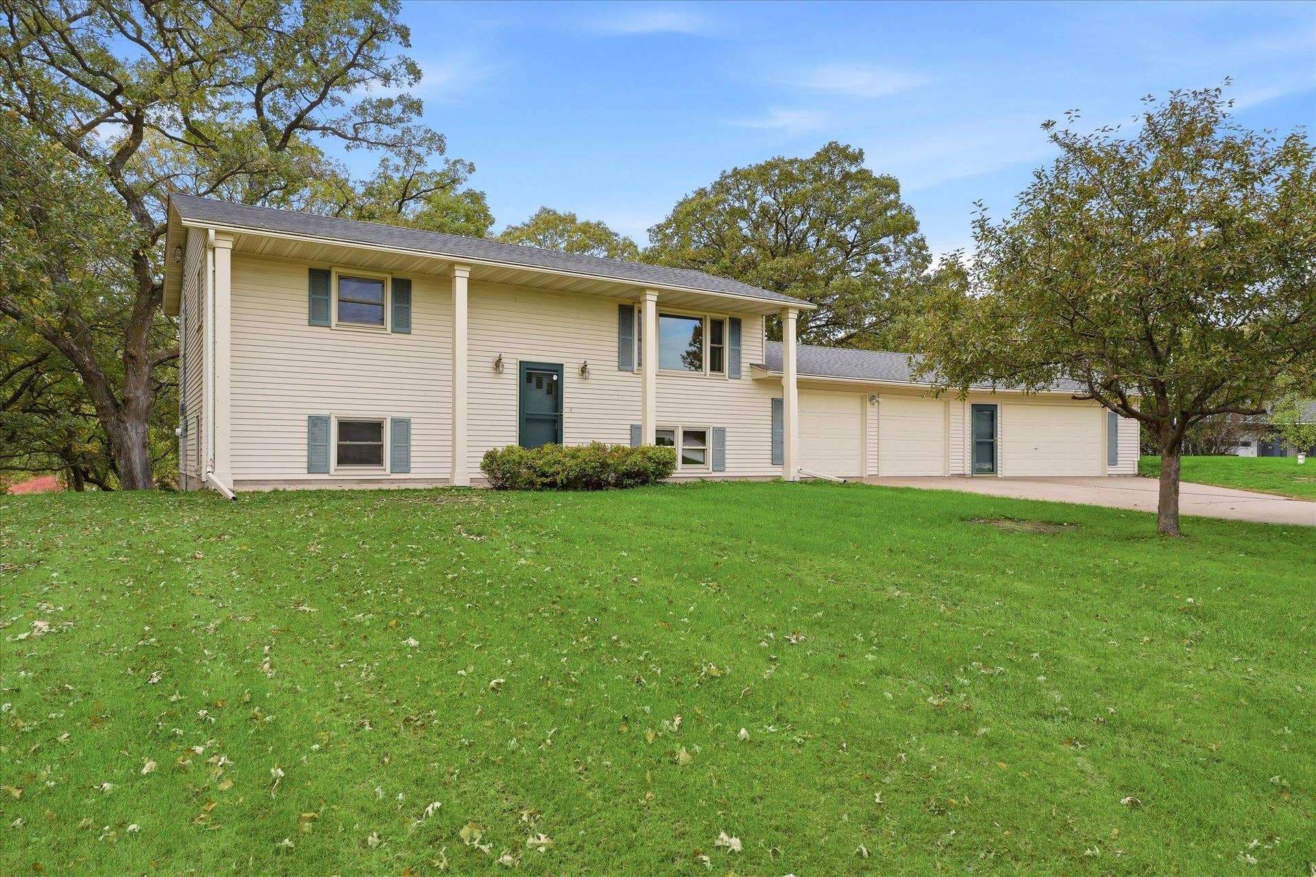 20761 187th Avenue NW, Big Lake, MN 55309 Beautiful exterior view showcasing the homes stately pillars and low-maintenance metal siding.