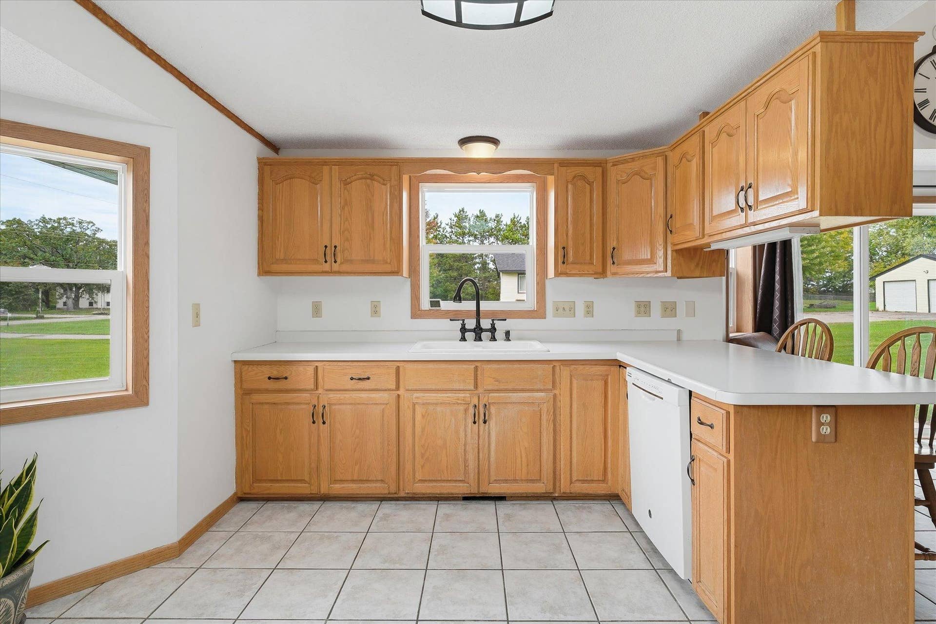 20720 187th Avenue NW, Big Lake, MN 55309 Large kitchen offers extensive counter space surrounding the sink, providing plenty of room for meal prep and everyday use.