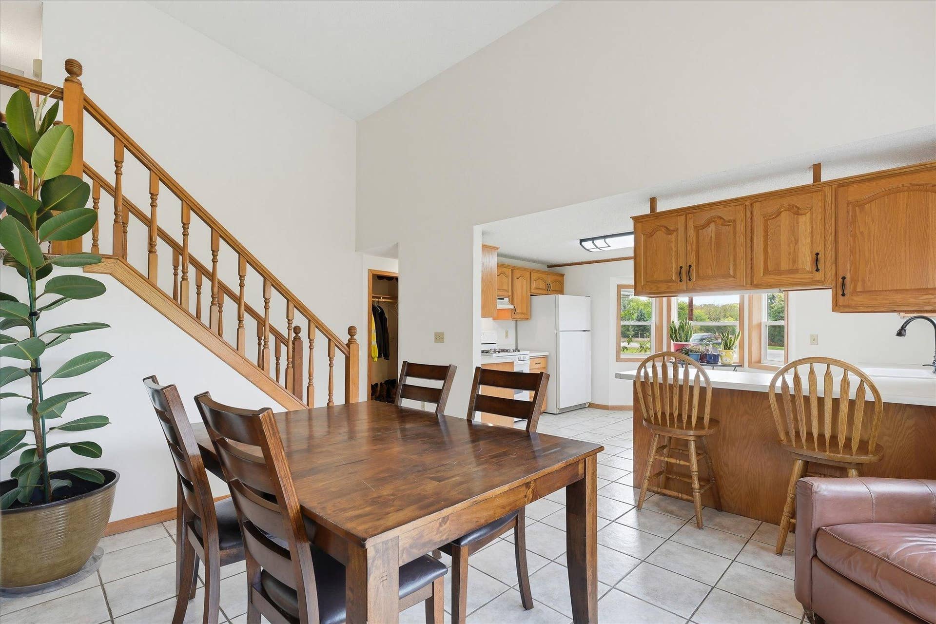 20720 187th Avenue NW, Big Lake, MN 55309 Open kitchen and dining spaces offer an easy flow for everyday living and entertaining, with vaulted ceilings and warm natural wood accents throughout.