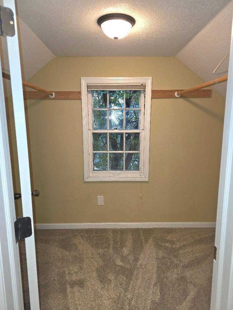 Primary bedroom walk in closet