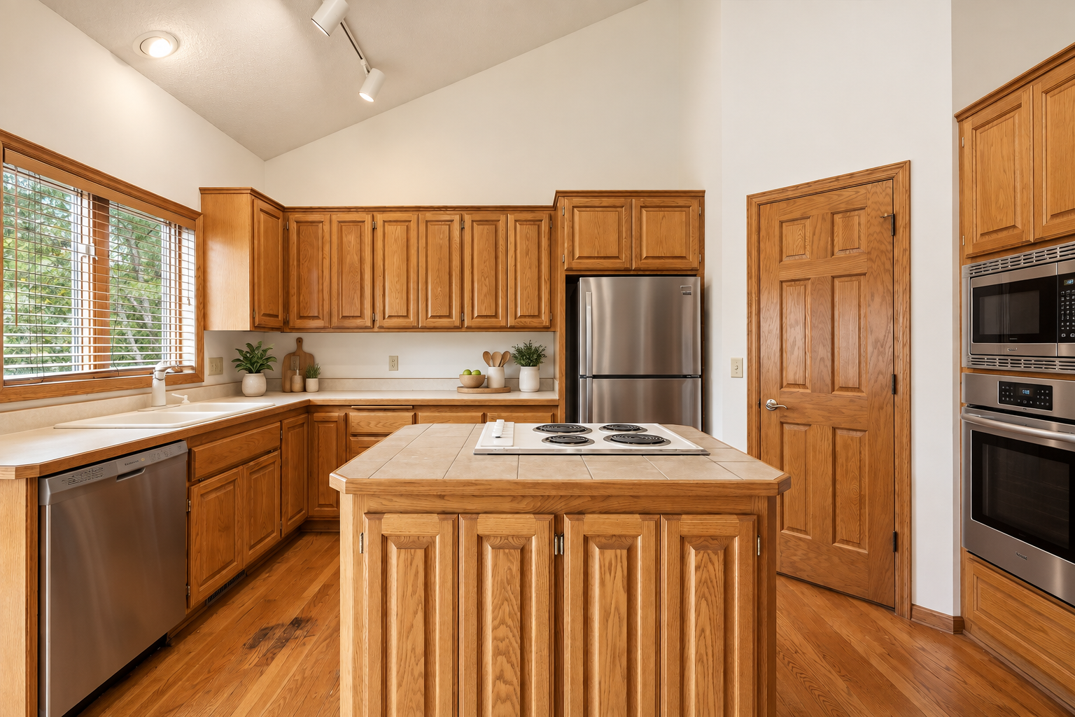 Spacious, inviting kitchen featuring updated appliances and a functional layout designed for everyday living and entertaining! (Image virtually staged)
