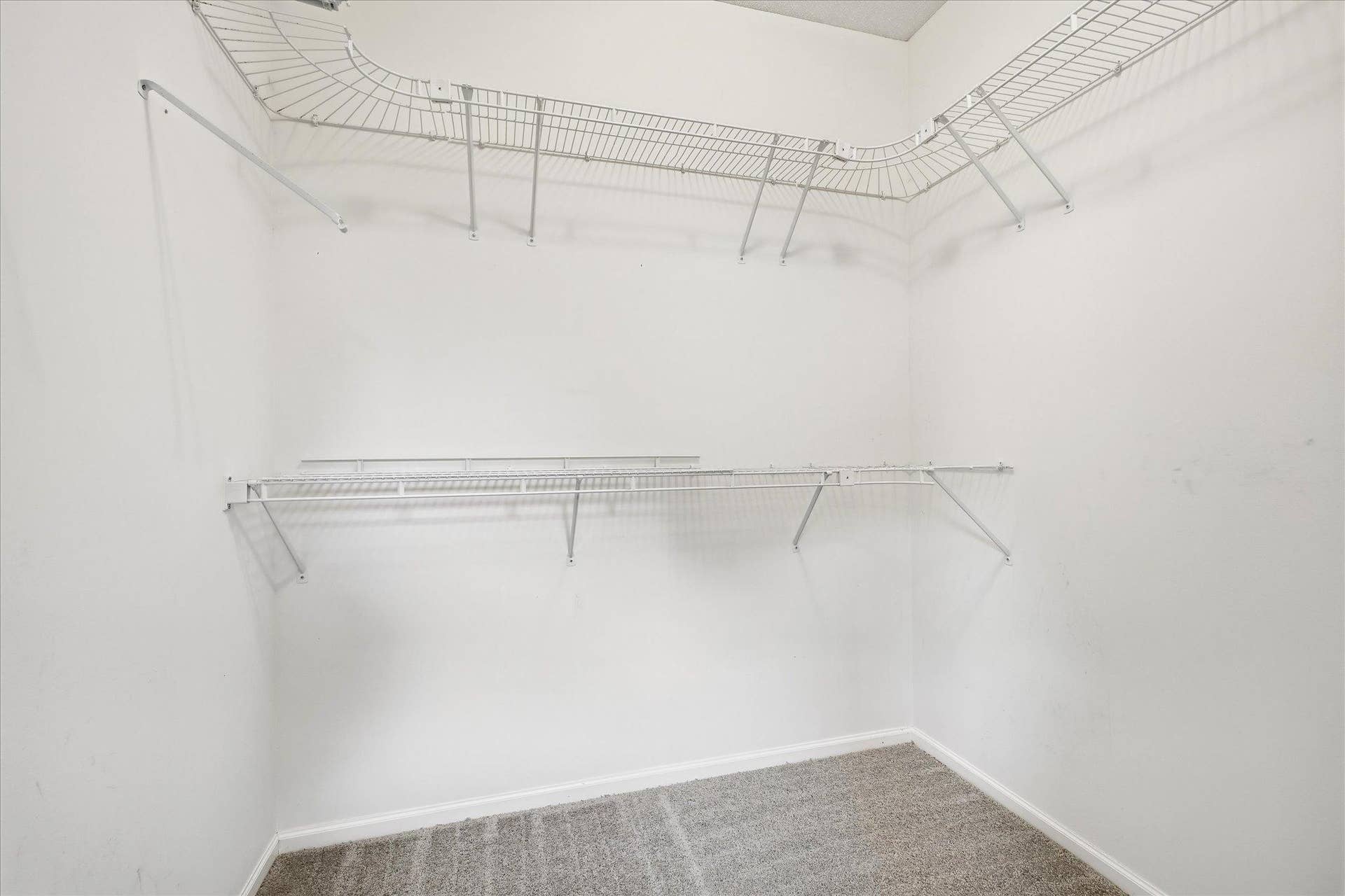 Large walk-in closet offers abundant storage, making staying organized a breeze!