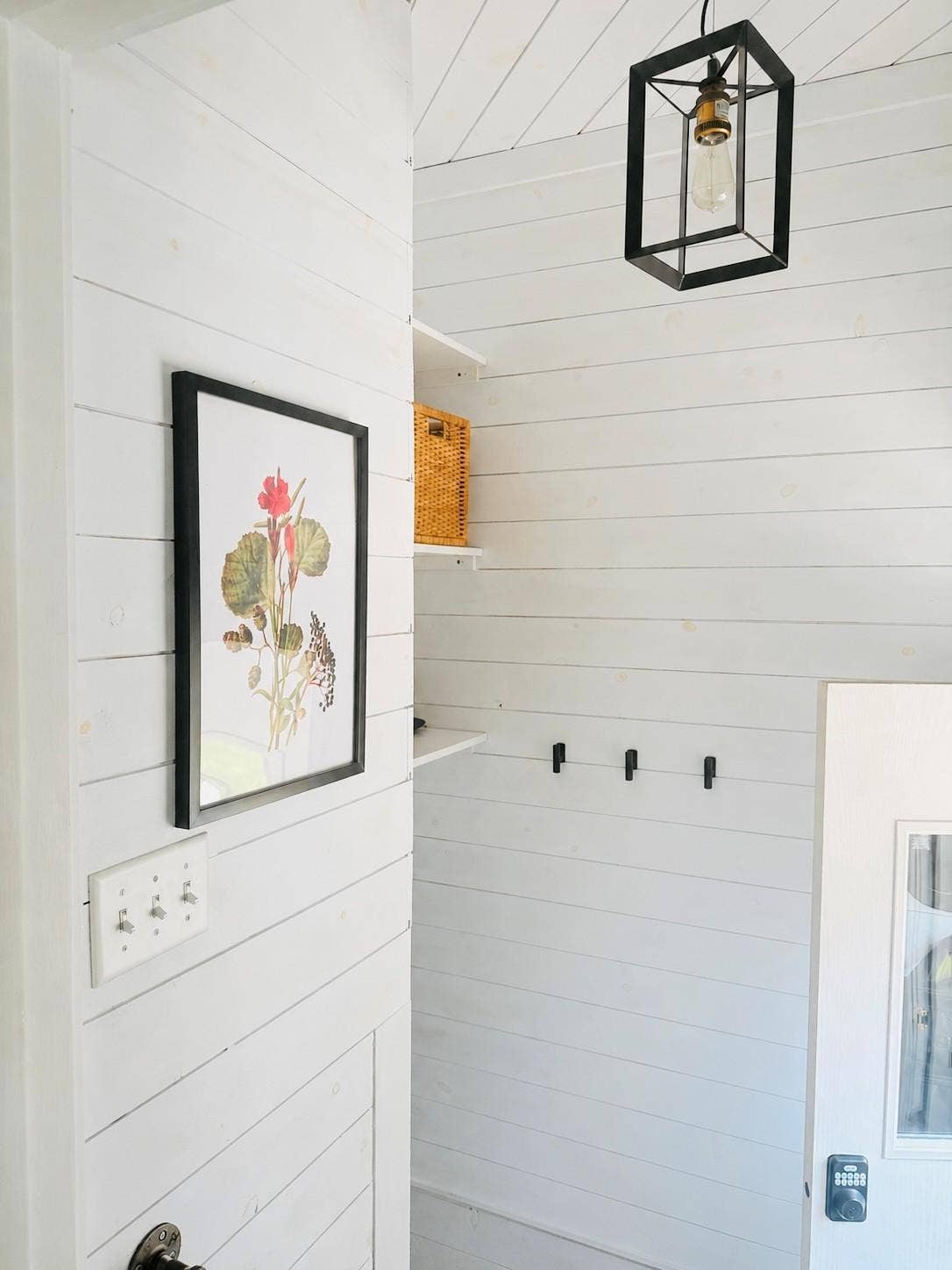 5115 Bloomington Avenue, 29, Minneapolis, MN 55417 The back entryway has shiplap and new lighting. There are hooks for coats, a shoe rack, and above the stairway storage.