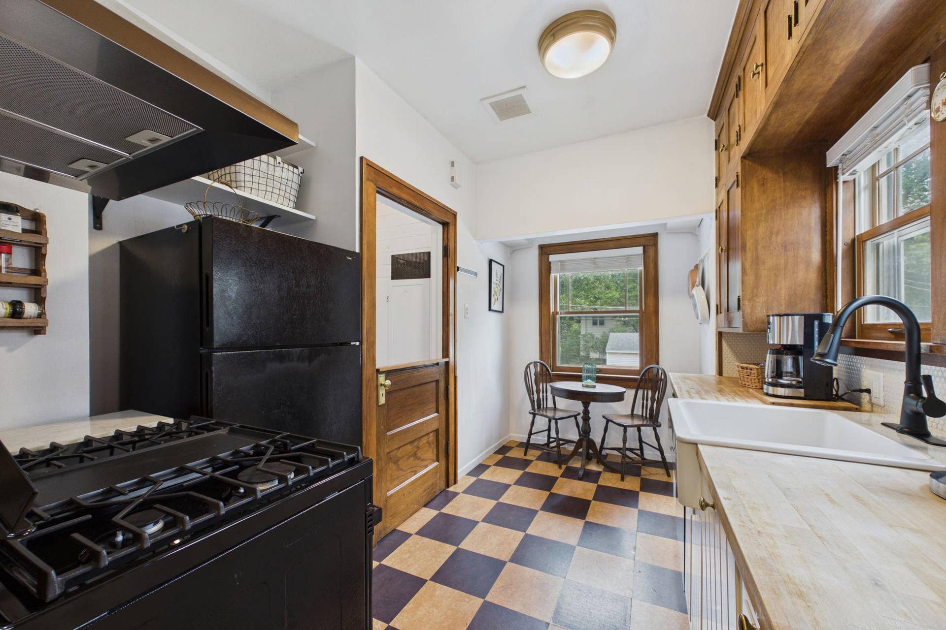 5115 Bloomington Avenue, 29, Minneapolis, MN 55417 The kitchen has the original cabinets, butcher block counters, and storage over the refrigerator, and a cute 1/2 door leading to the lower level.