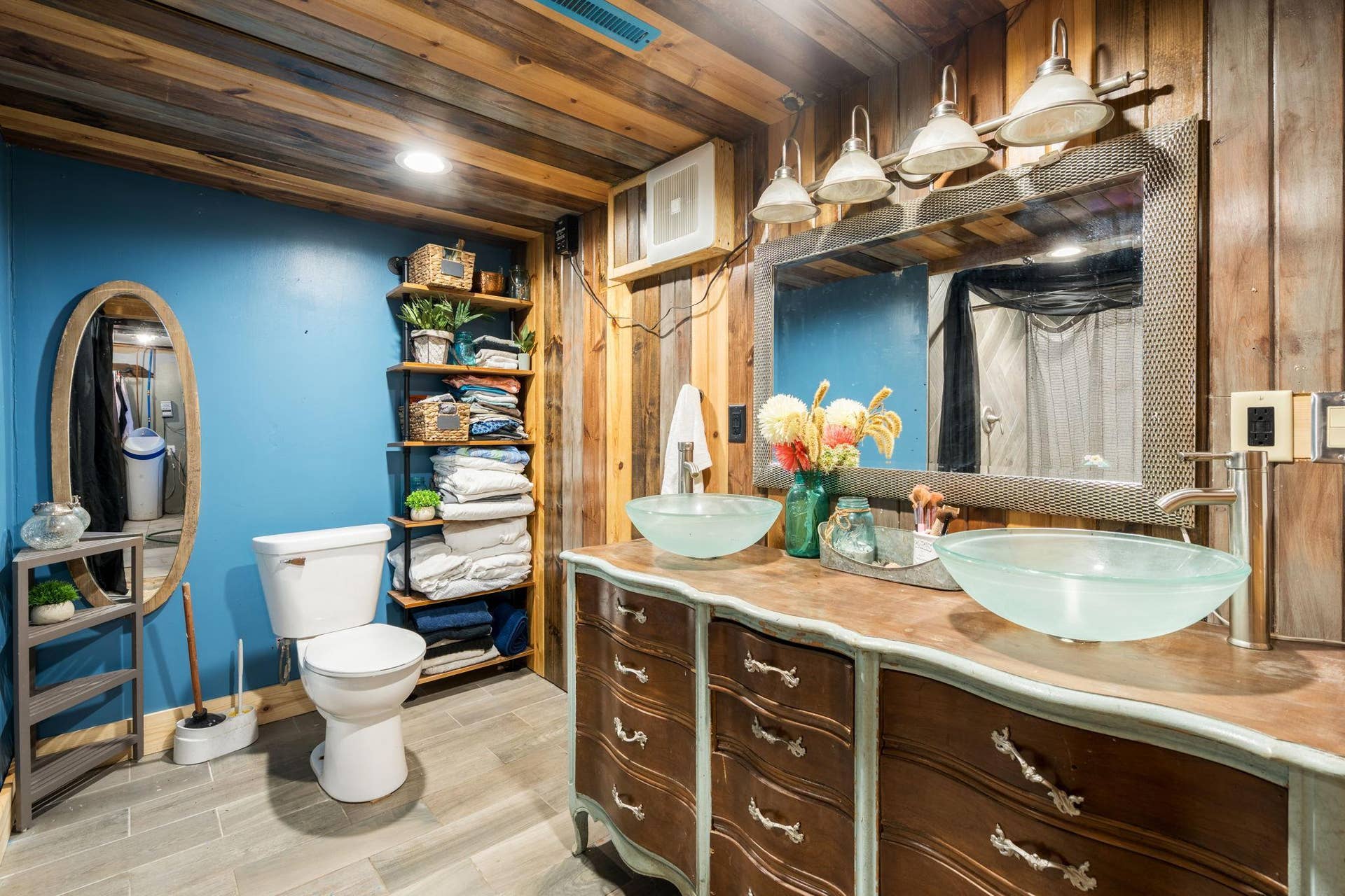 465 70th Avenue, Clayton, WI 54004 A truly unique updated bath featuring warm wood finishes, dual vessel sinks and a furniture-style vanity.