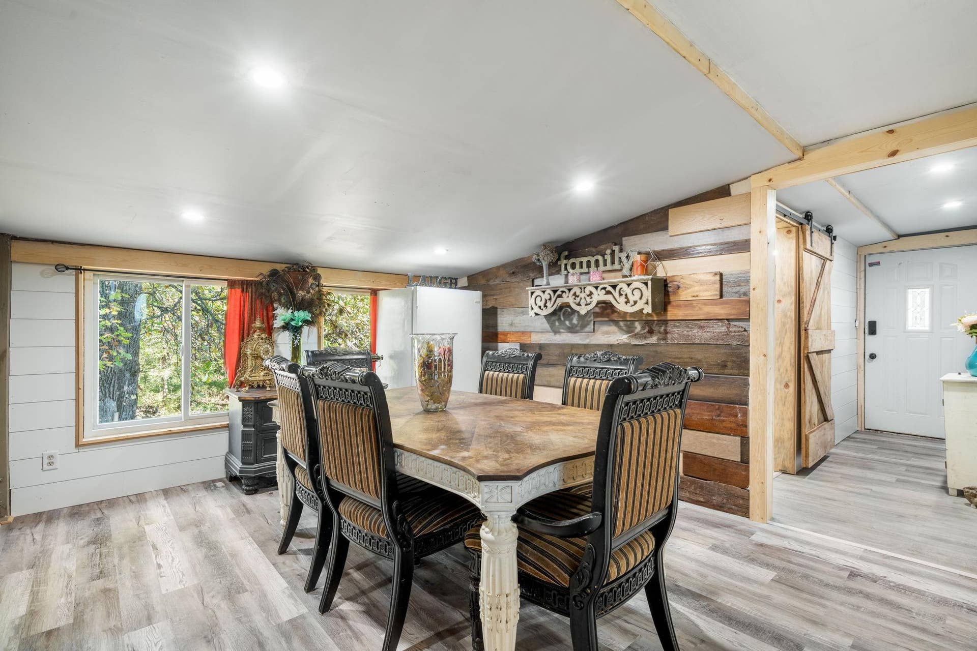 465 70th Avenue, Clayton, WI 54004 A spacious dining area with a beautiful wood accent wall and plenty of room for everyday meals or a full house around the table.
