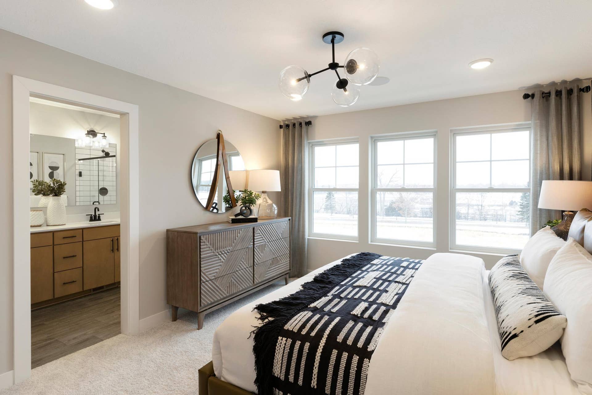 838 Woodlawn Avenue, 94, Saint Paul, MN 55116 Owners Bedroom and Bath. Photo is of a similar model home.
