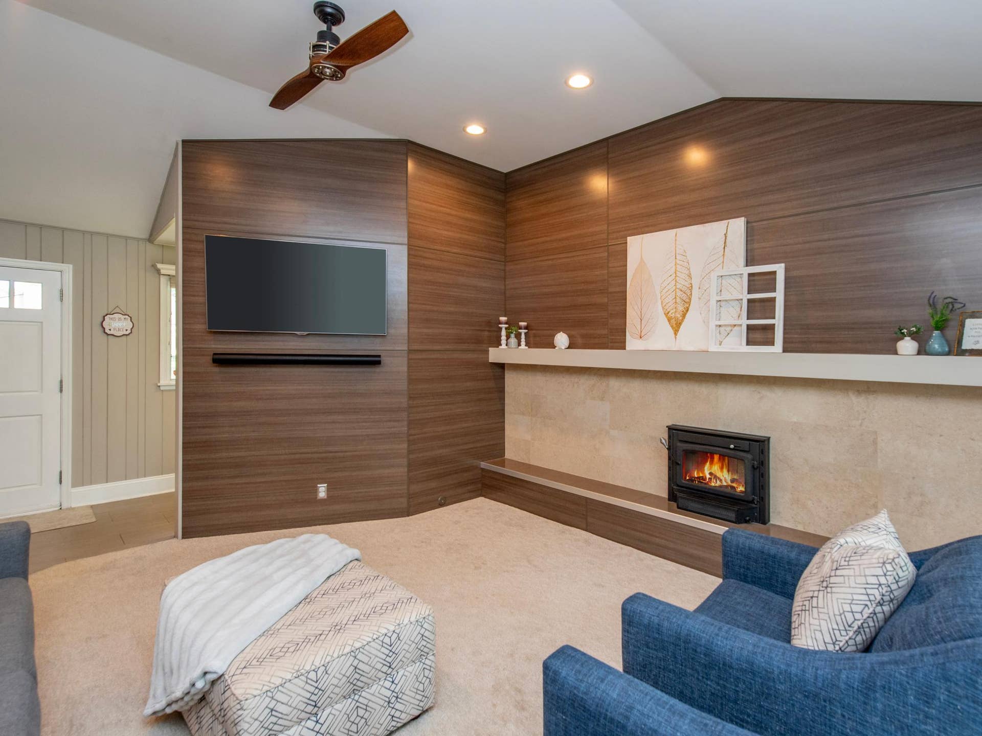 1492 Red Cedar Road, Eagan, MN 55121 A stunning accent wall is complemented by a wood-burning fireplace with a beautiful tile surround as you enter the home.