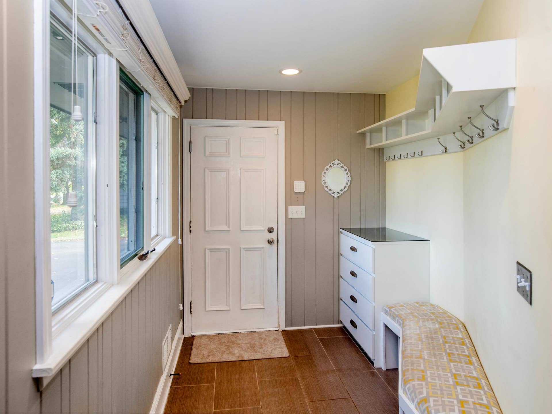 1492 Red Cedar Road, Eagan, MN 55121 Built-in seating and ample storage make this mudroom foyer both functional and welcoming.