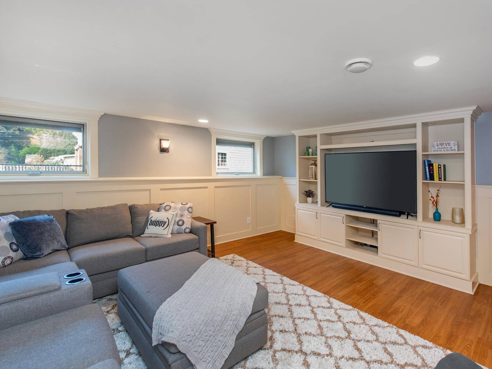 1492 Red Cedar Road, Eagan, MN 55121 The lower-level family room features classic wainscoting and custom built-ins, creating a warm and inviting gathering space.
