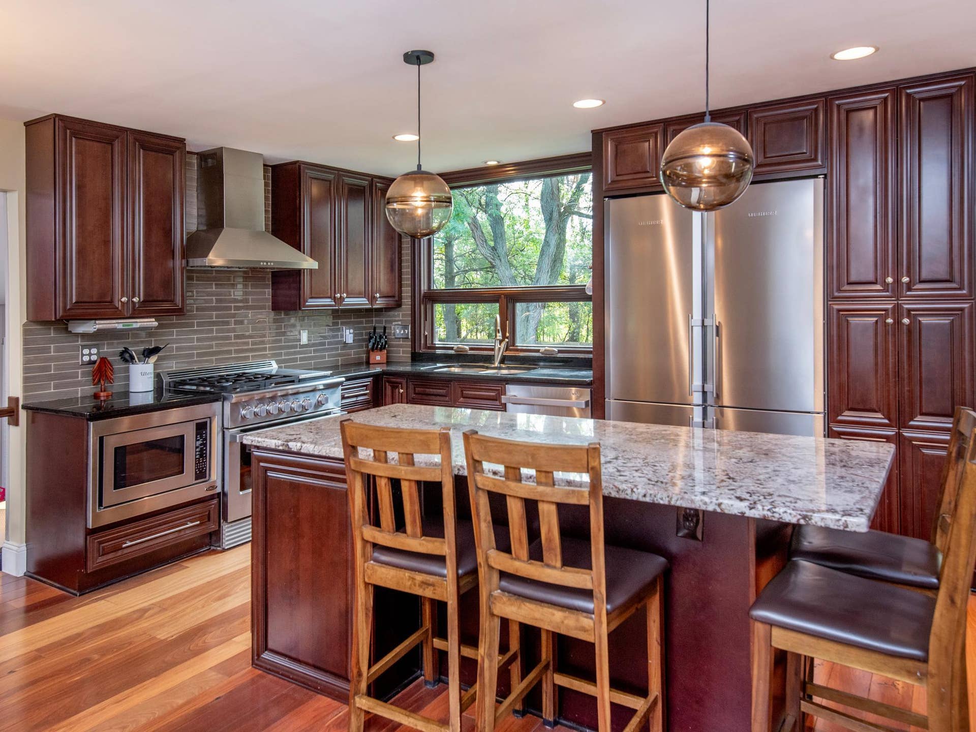 1492 Red Cedar Road, Eagan, MN 55121 An oversized window fills the space with natural light while offering a lovely view of the backyard.