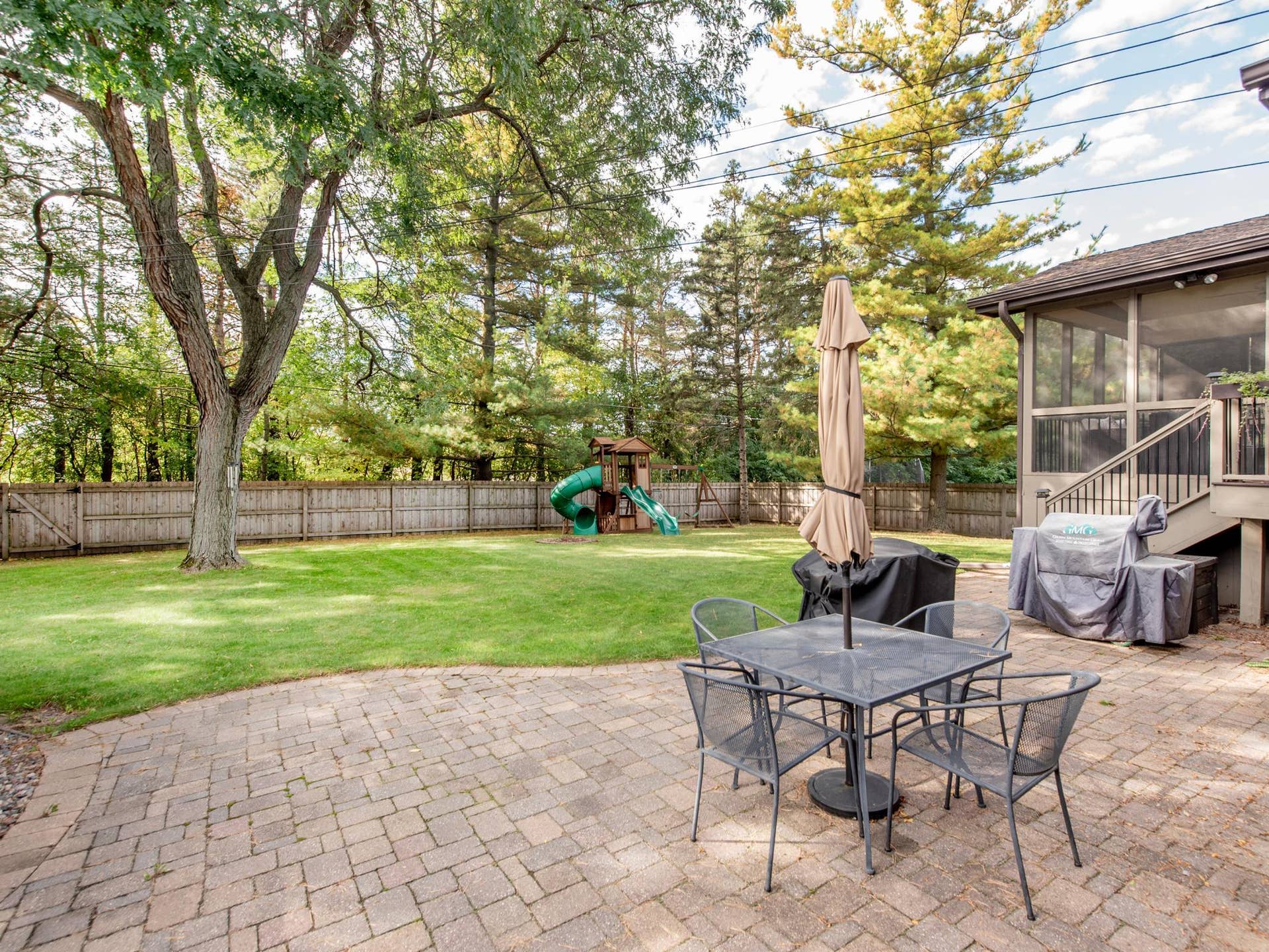 1492 Red Cedar Road, Eagan, MN 55121 A beautiful paver patio provides the perfect spot to enjoy the expansive, private backyard.