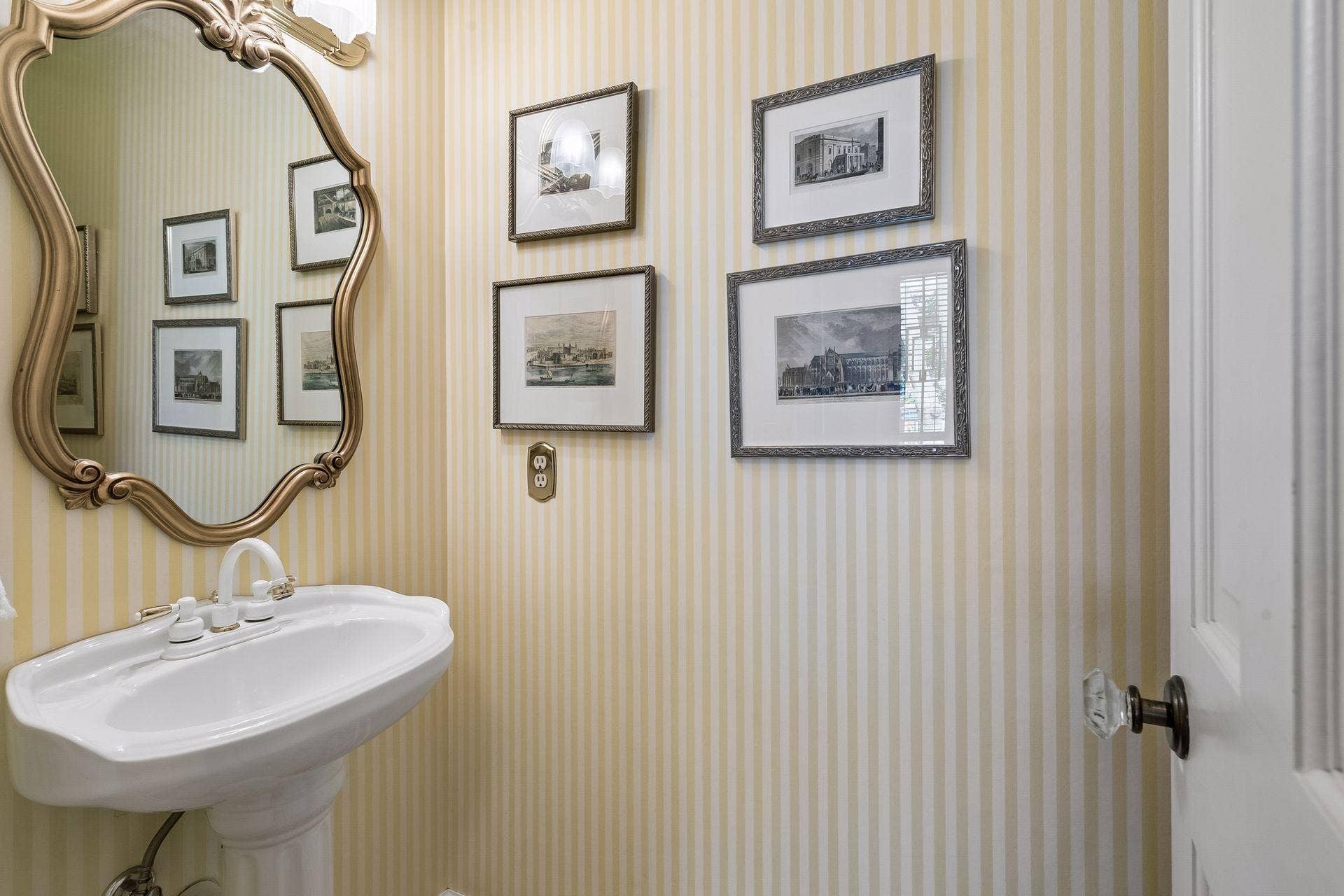 1/2 bath located off the foyer
