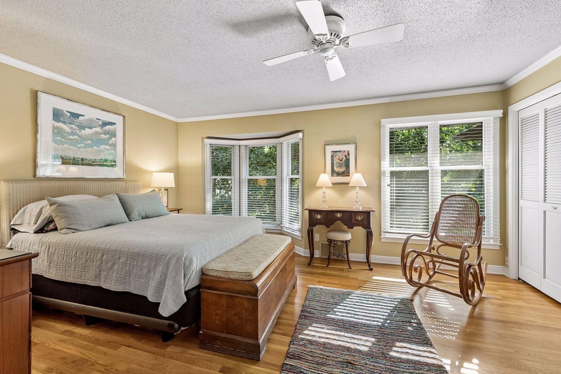 Bedroom #1 is a spacious bedroom with great views of the treetops. Crown molding, hardwood floors, and two generously sized closets.