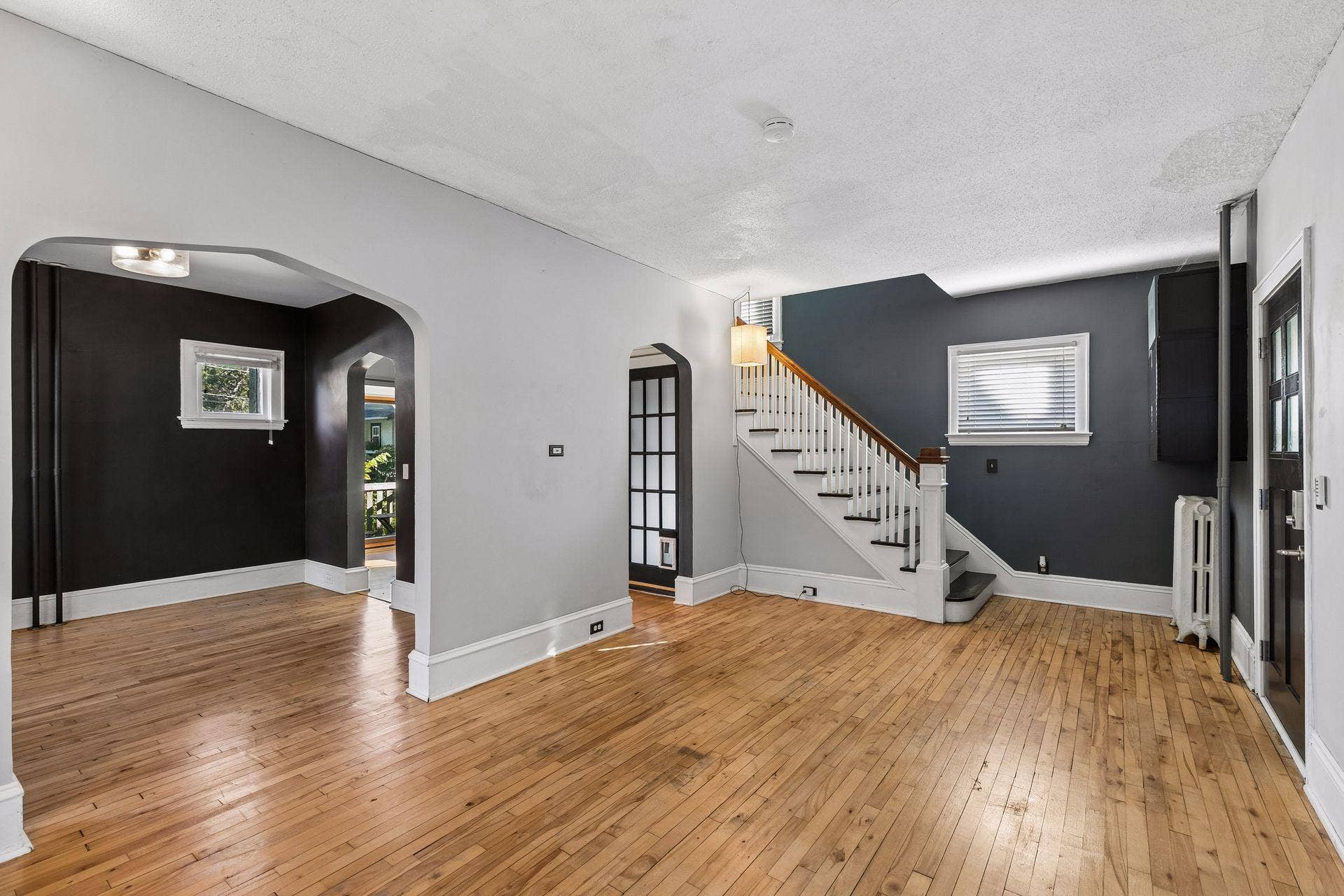3112 E 33rd Street, 44, Minneapolis, MN 55406 This view gives a great look at the main level flow, with the living room opening into the dining space and stairs leading to the upper level bedrooms.