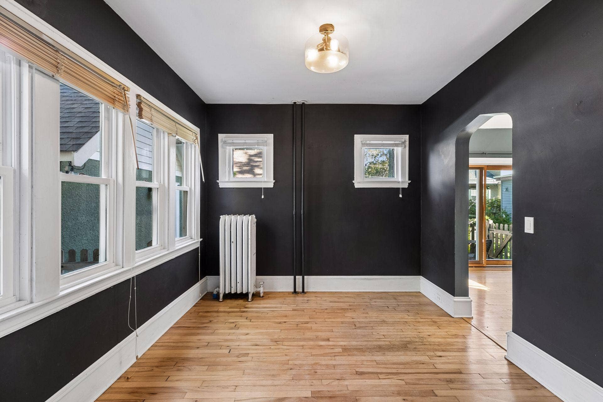 3112 E 33rd Street, 44, Minneapolis, MN 55406 Four windows bring plenty of natural light to the formal dining space, where hardwood floors and stylish overhead lighting add warmth and character.