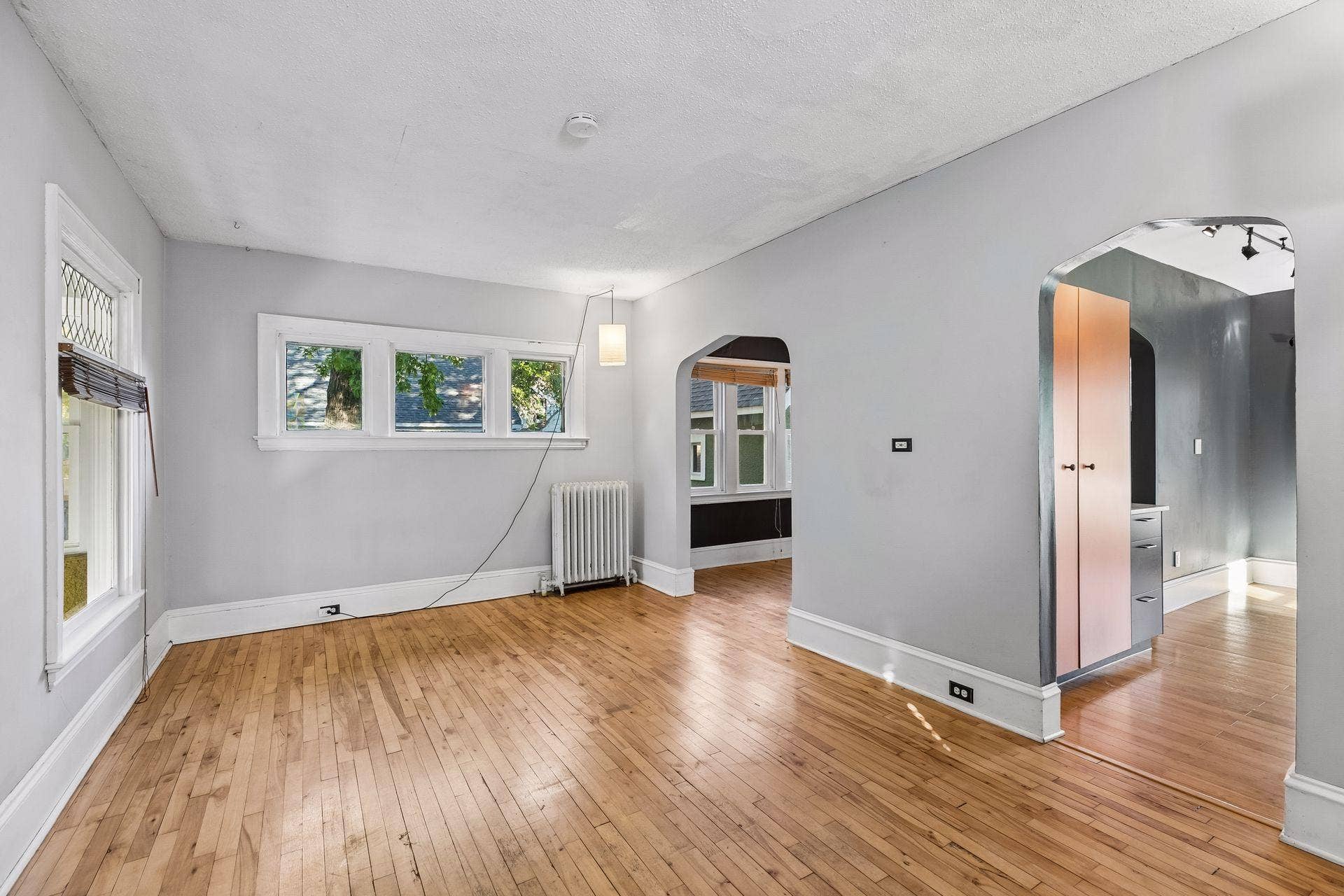 3112 E 33rd Street, 44, Minneapolis, MN 55406 Hardwood flooring and an abundance of windows bring warmth and natural light to the living room, which flows easily into the kitchen and formal dining space.