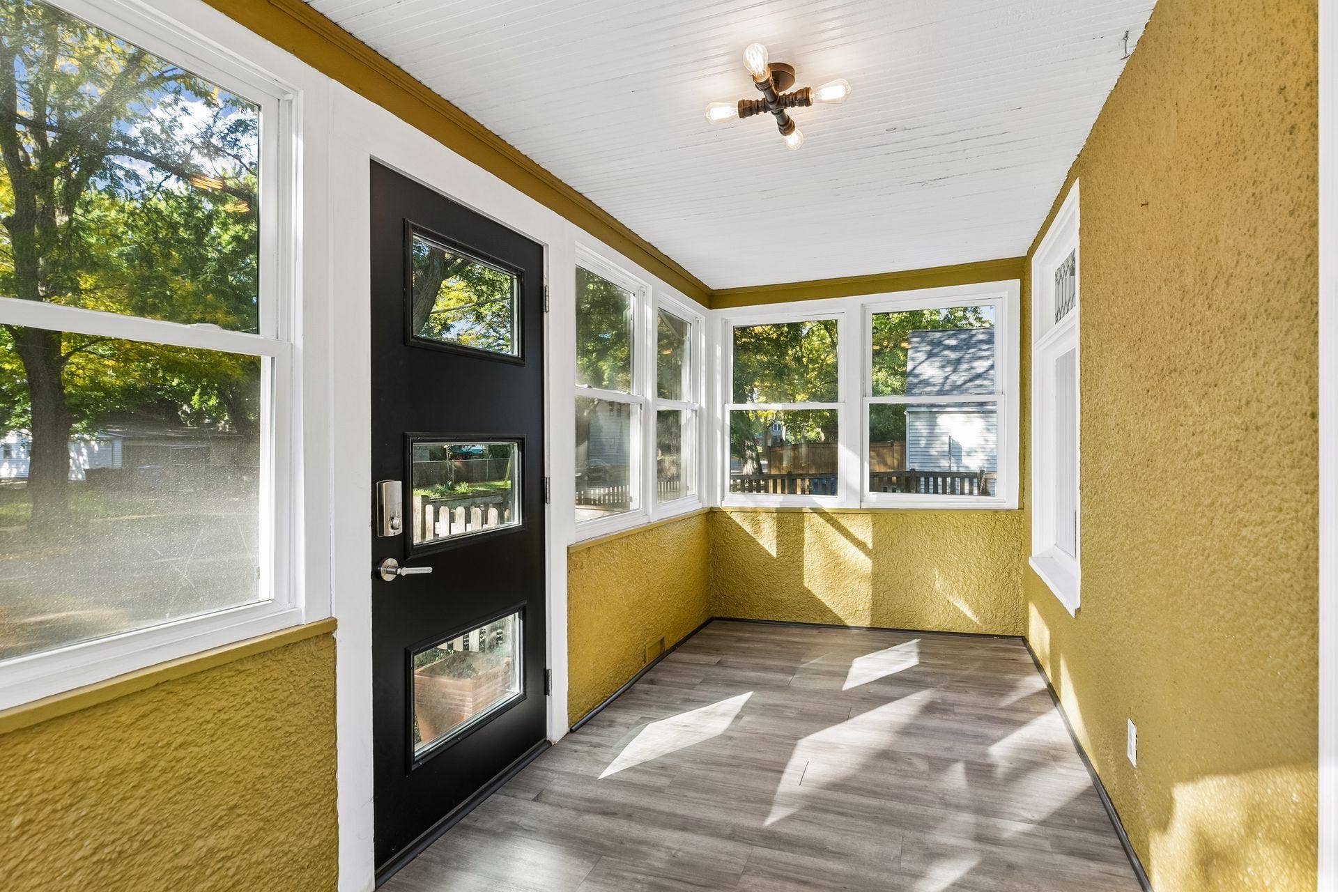 3112 E 33rd Street, 44, Minneapolis, MN 55406 Step inside through the inviting three season porch, a cozy space to relax and enjoy the changing seasons.