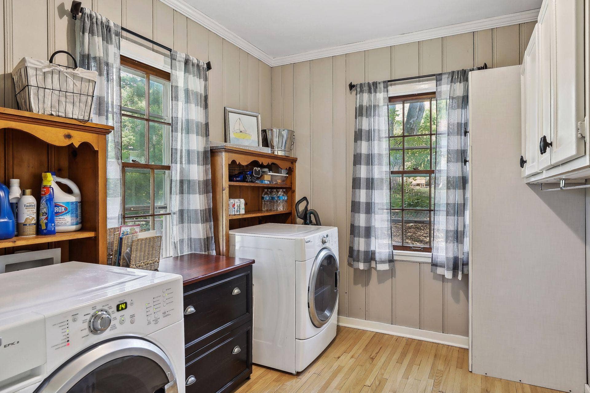 Main floor laundry room offers great storage!  Laundry could be moved back to the basement, if new owner wishes to use this space for another purpose.