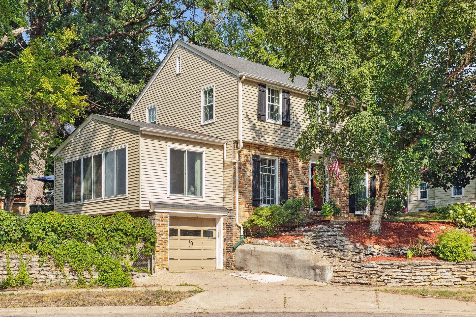 Situated on a large, elevated lot in Highland Park.