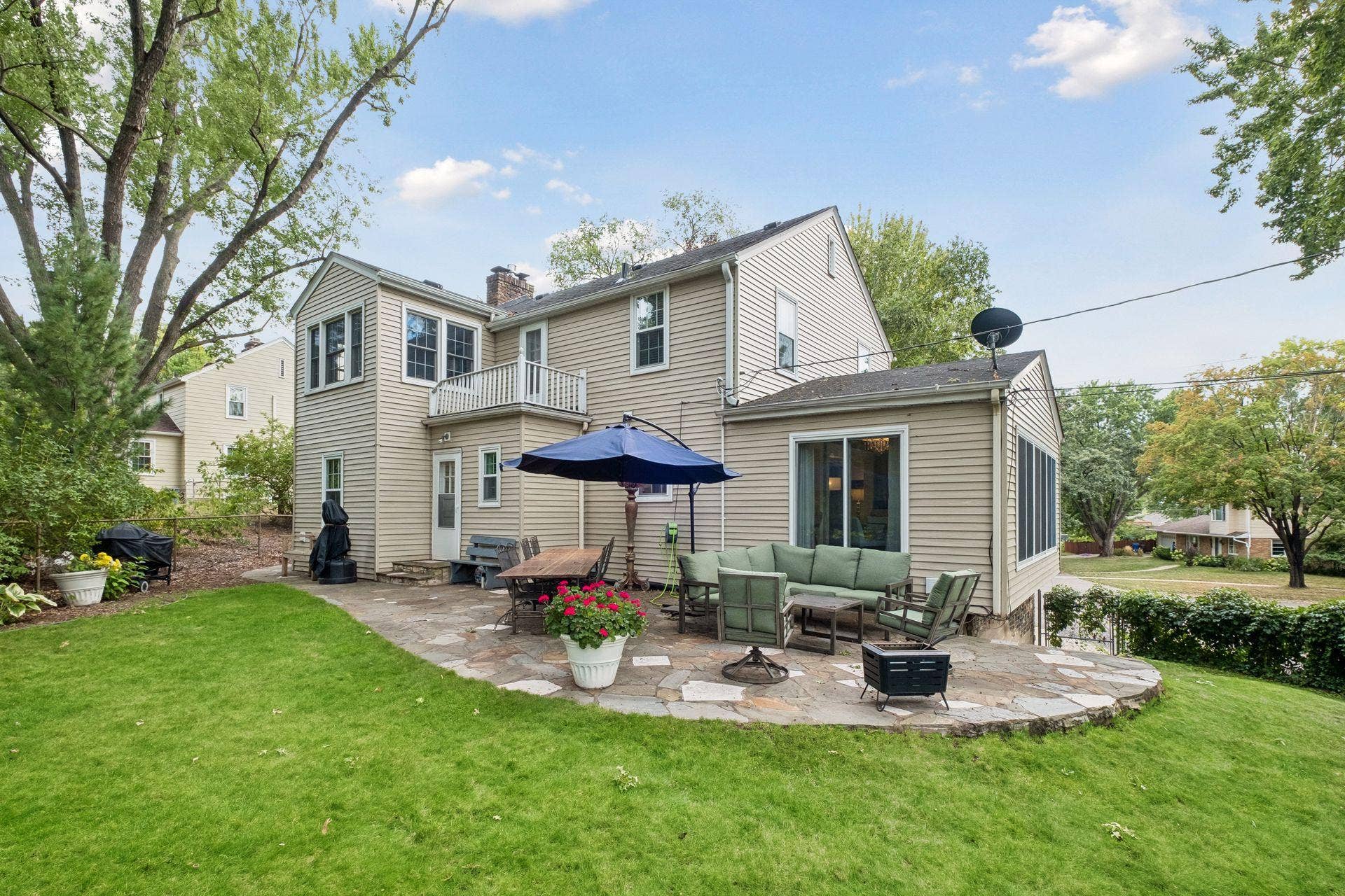 Spawling, spacious yard with custom paver patio.