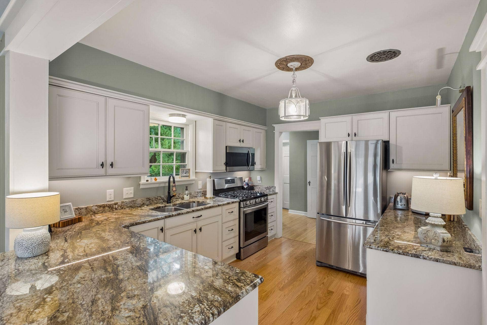Thoughtfully designed newer kitchen with a breakfast bar and ample workspace.