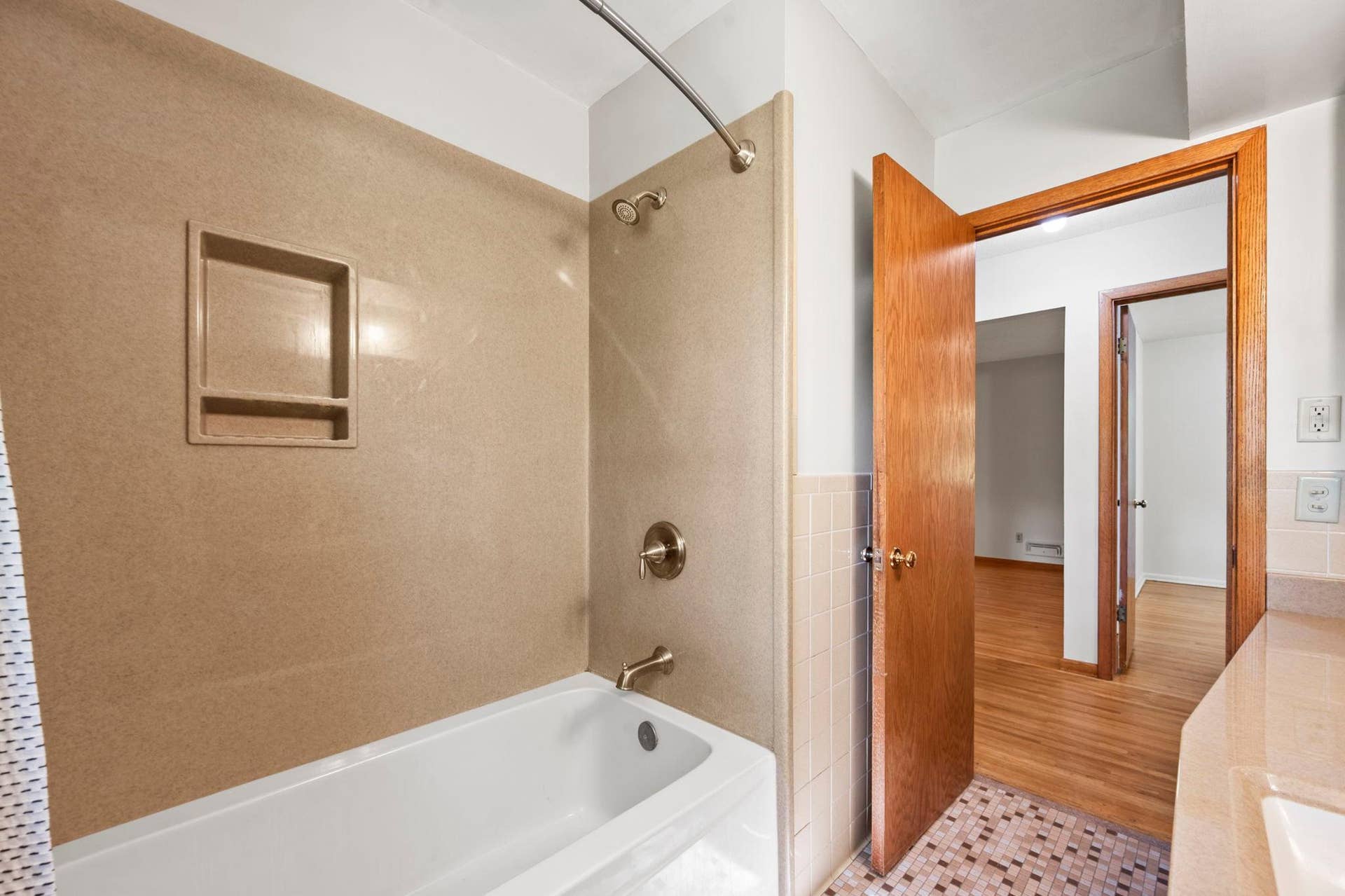 6609 74th Avenue N, Brooklyn Park, MN 55428 Shower enclosure provides a thoughtful update while preserving the home's original charm.